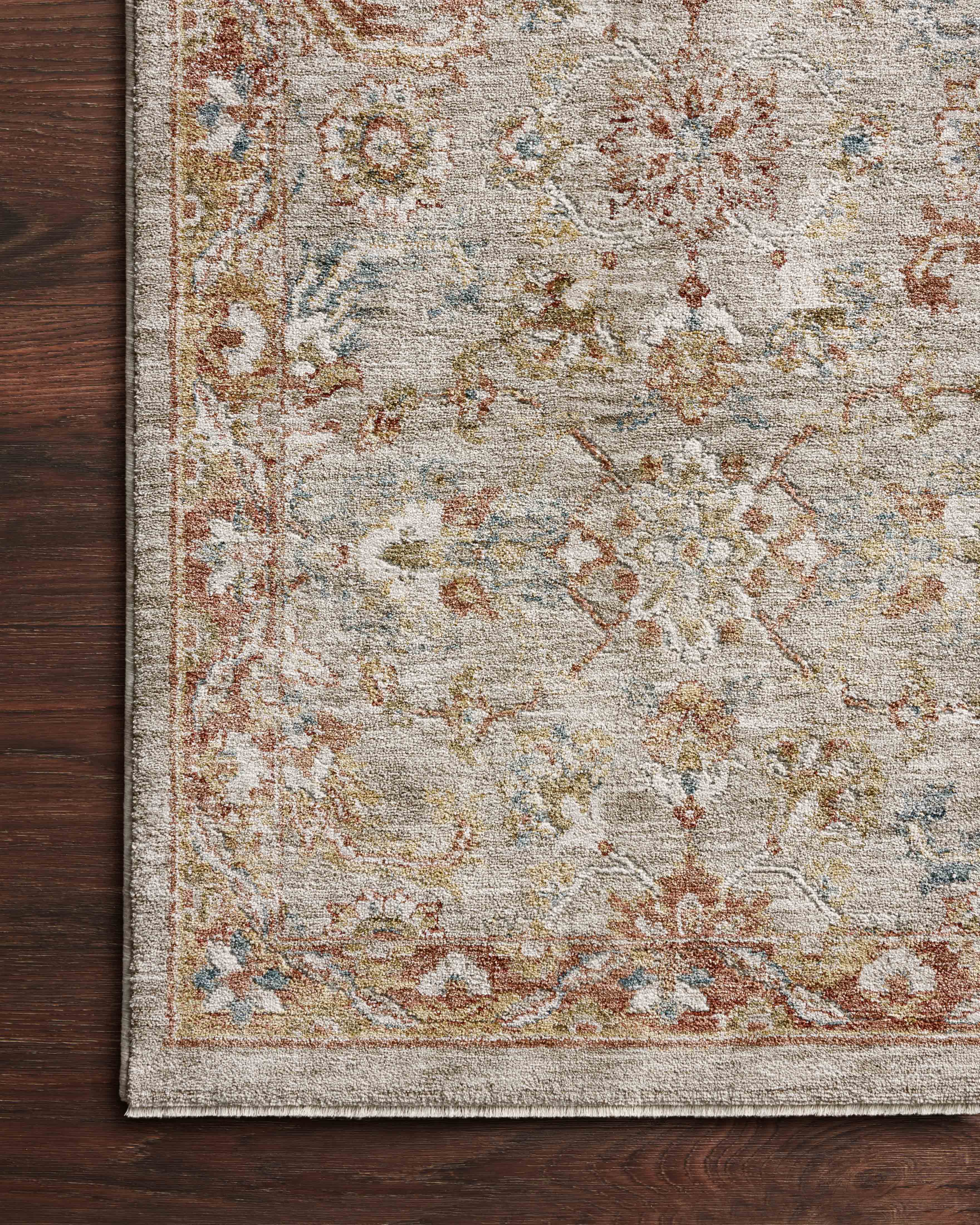 A power-loomed 100% polyester area rug featuring traditional and abstract design and warm natural and vibrant multi-toned tones, the Gaia GAA-05 Natural / Multi Area Rug adds character to any room