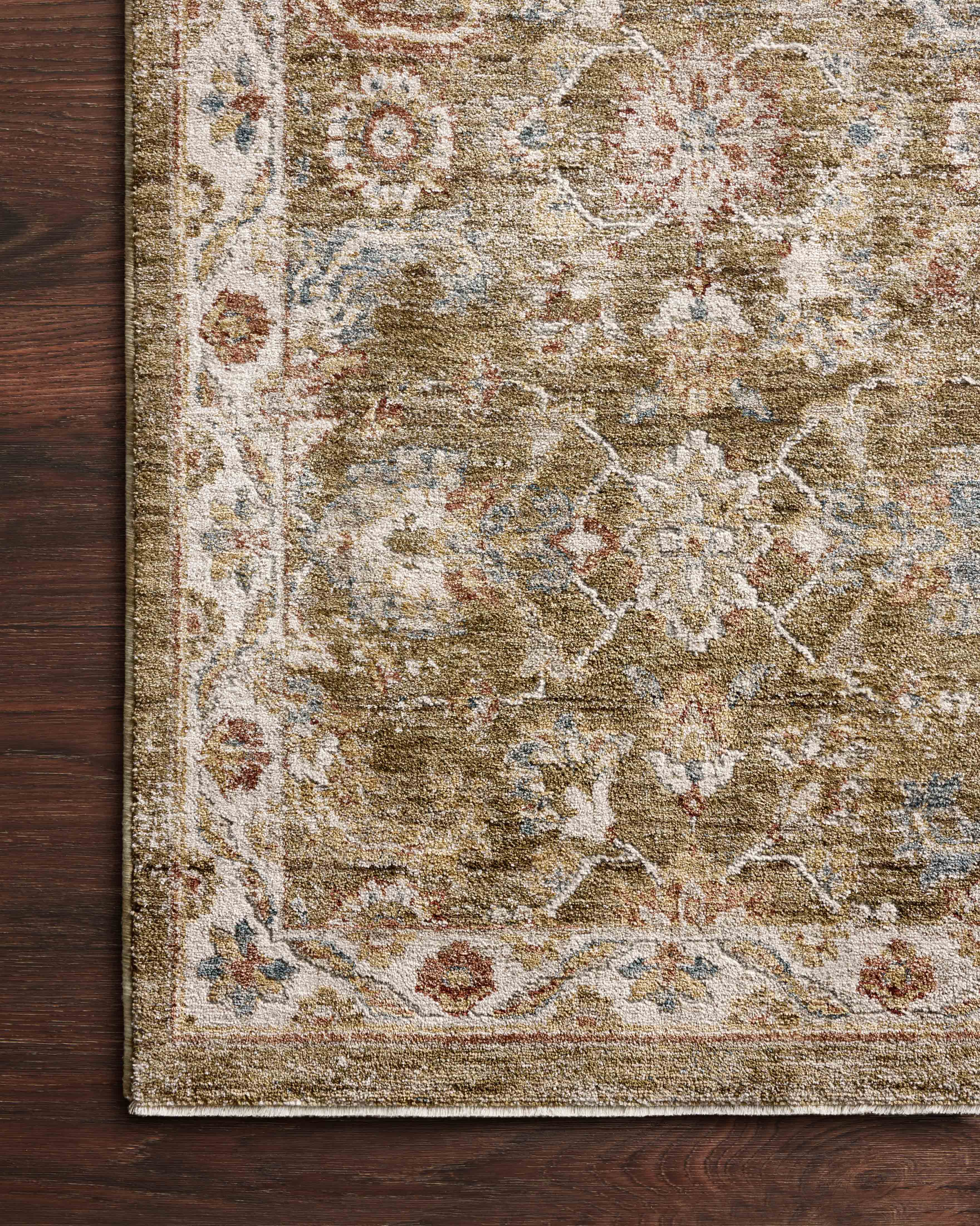 The Gaia GAA-05 Olive / Multi Area Rug highlights earthy olive and vibrant multi-toned tones and traditional and abstract texture in a beautifully made power-loomed 100% polyester area rug