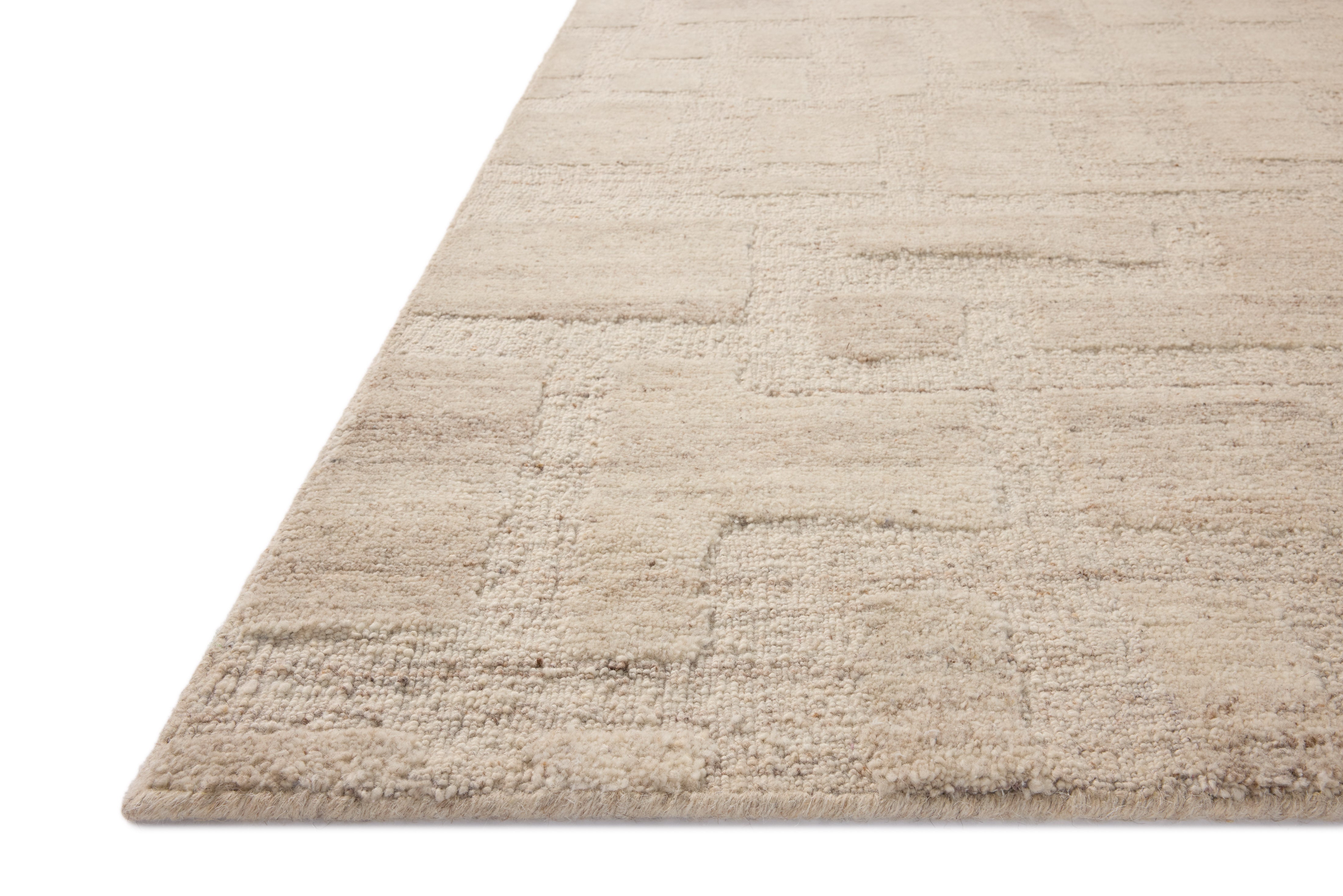 Crafted as a hand-tufted wool area rug, the Hartley HRT-01 Ivory / Natural Area Rug brings refined ivory and warm natural warmth and traditional character to your space