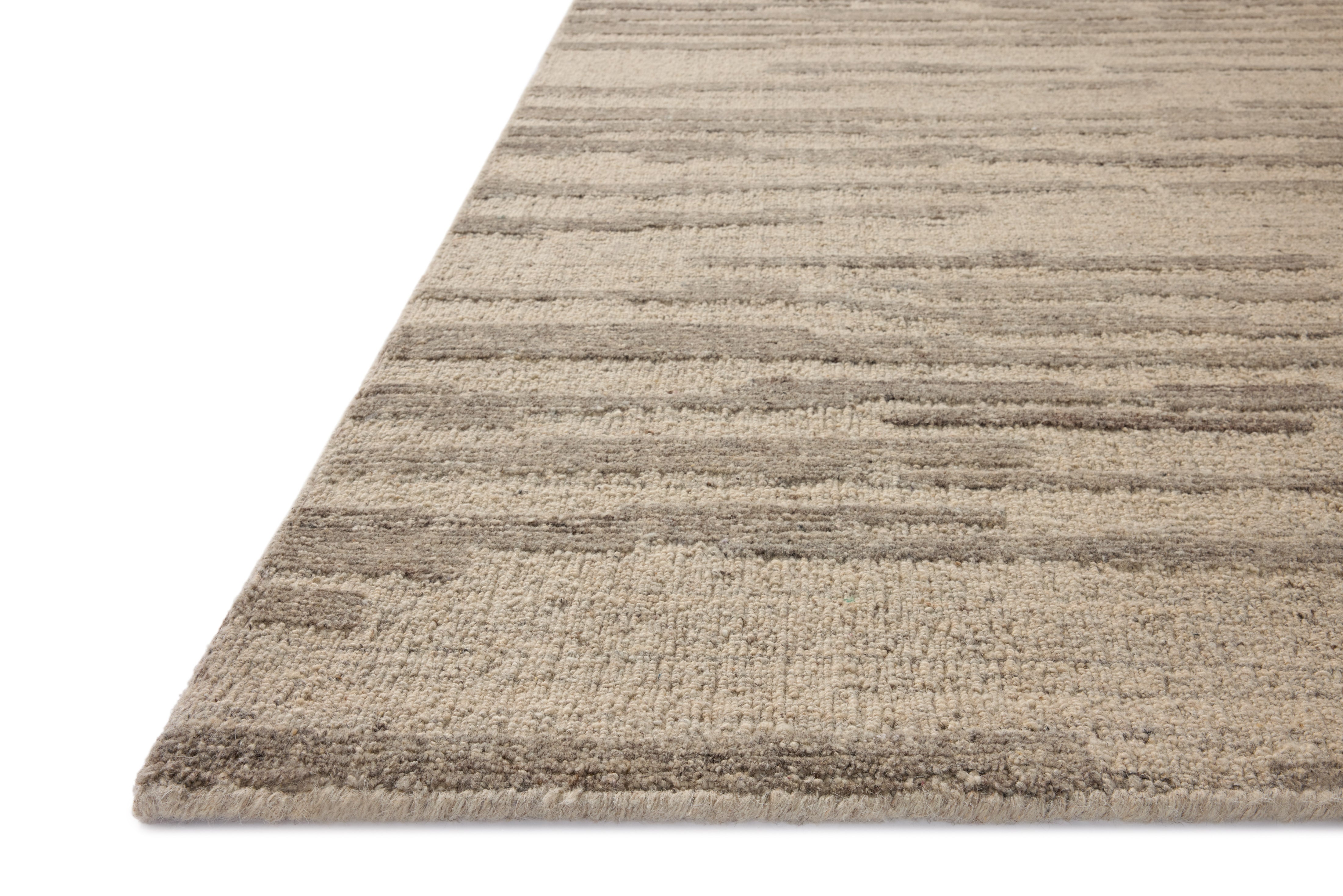 With shimmering silver and elegant grey hues and traditional styling, the Hartley HRT-02 Silver / Grey Area Rug is a hand-tufted wool area rug that elevates any room