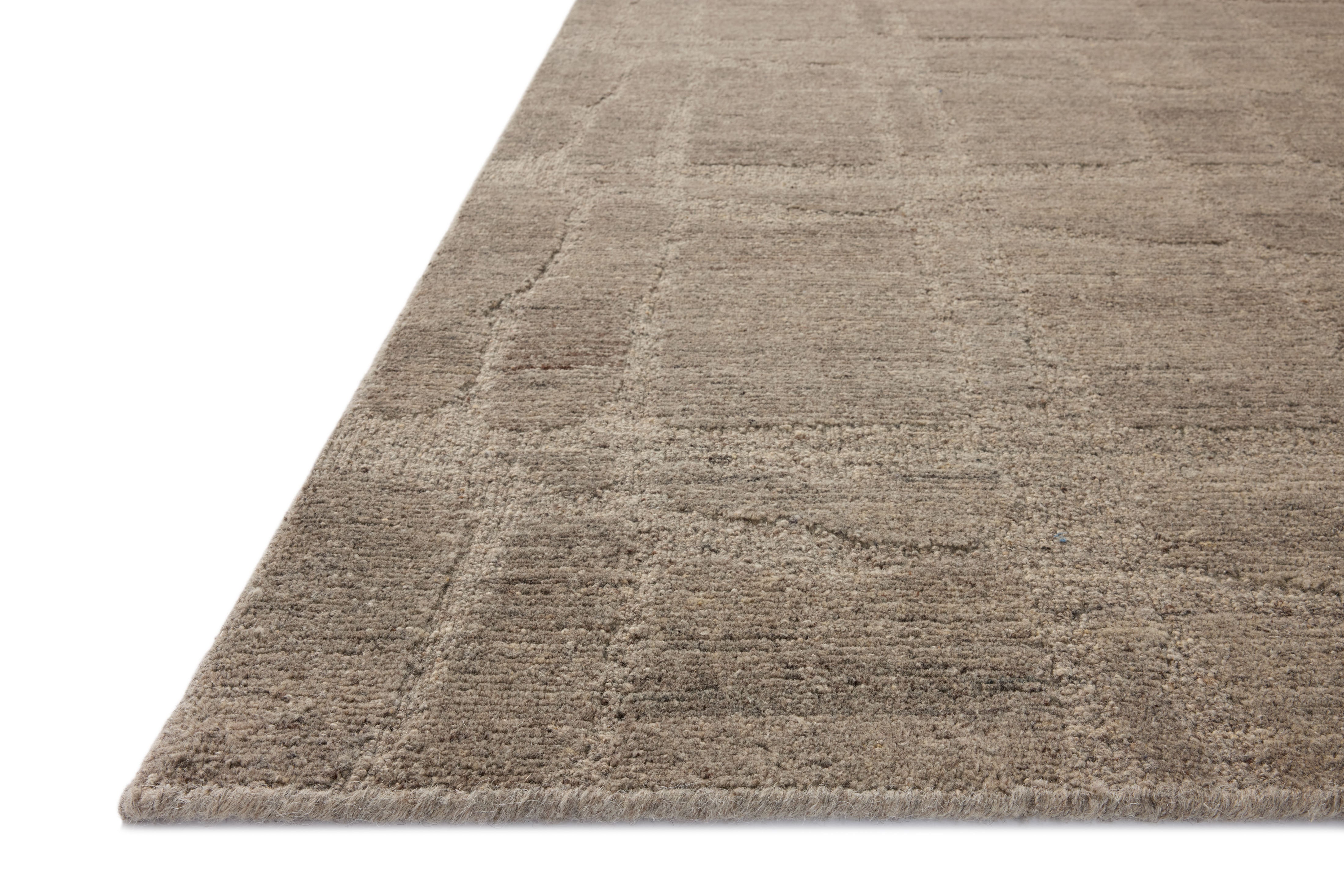 The Hartley HRT-03 Grey / Pebble Area Rug blends elegant grey and subtle pebble tones and traditional motifs into a hand-tufted wool area rug with timeless appeal