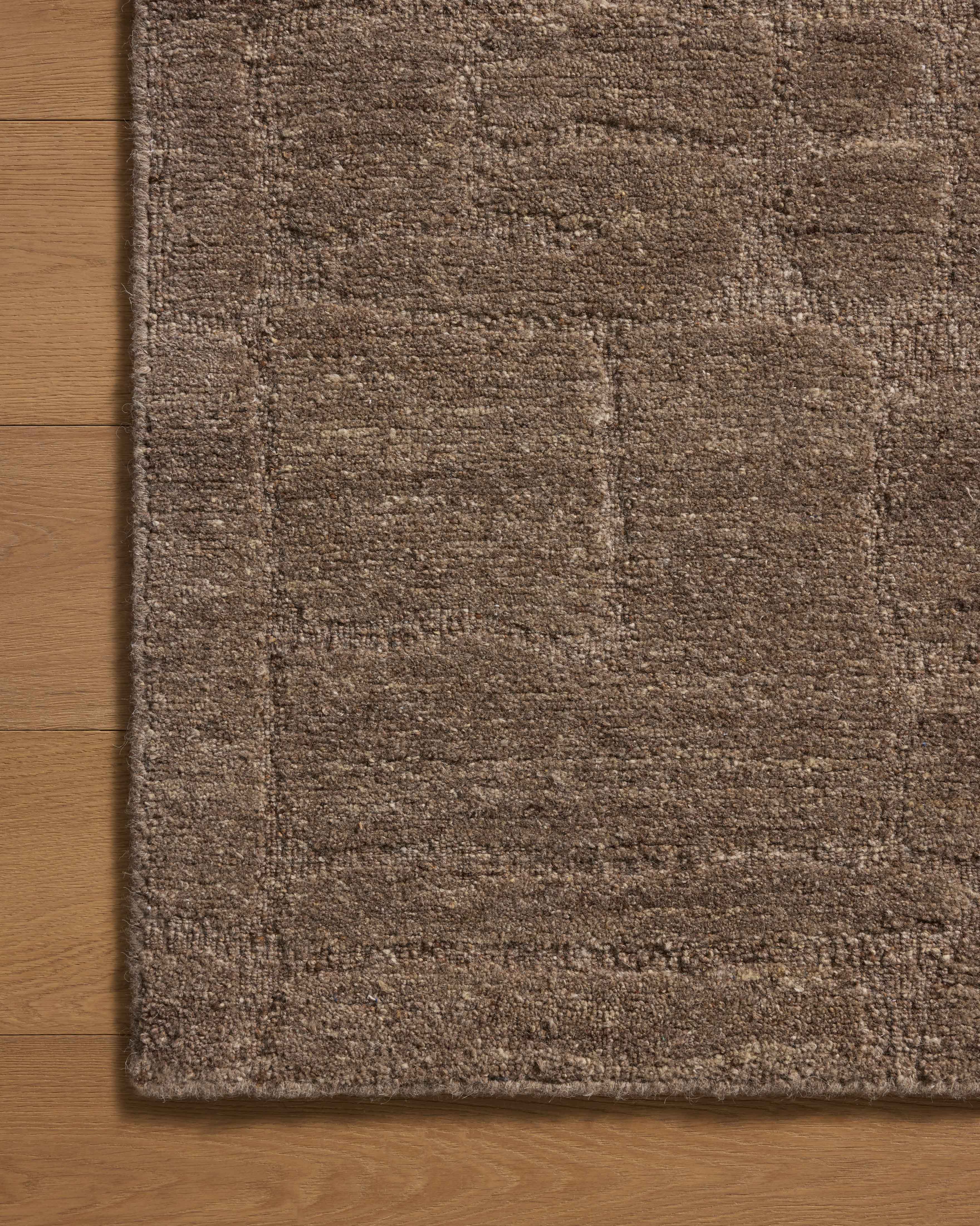 A stunning hand-tufted wool area rug with traditional detail, the Hartley HRT-04 Brown / Mocha Area Rug features brown and luxurious mocha tones for a polished look