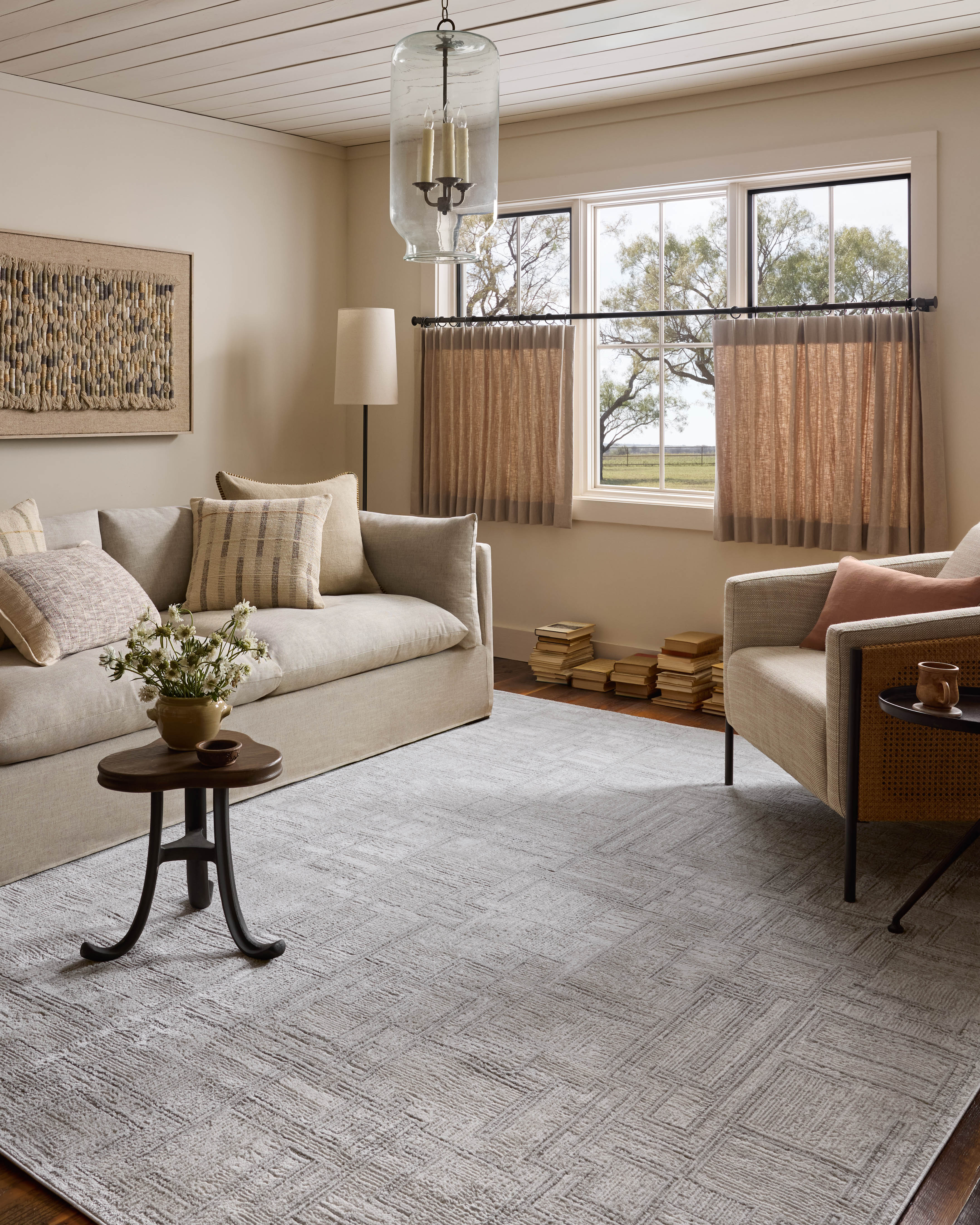 A power-loomed polyester area rug with geometric design in elegant grey and refined ivory hues, the Hollis HOL-01 Grey / Ivory Area Rug is a standout in any décor