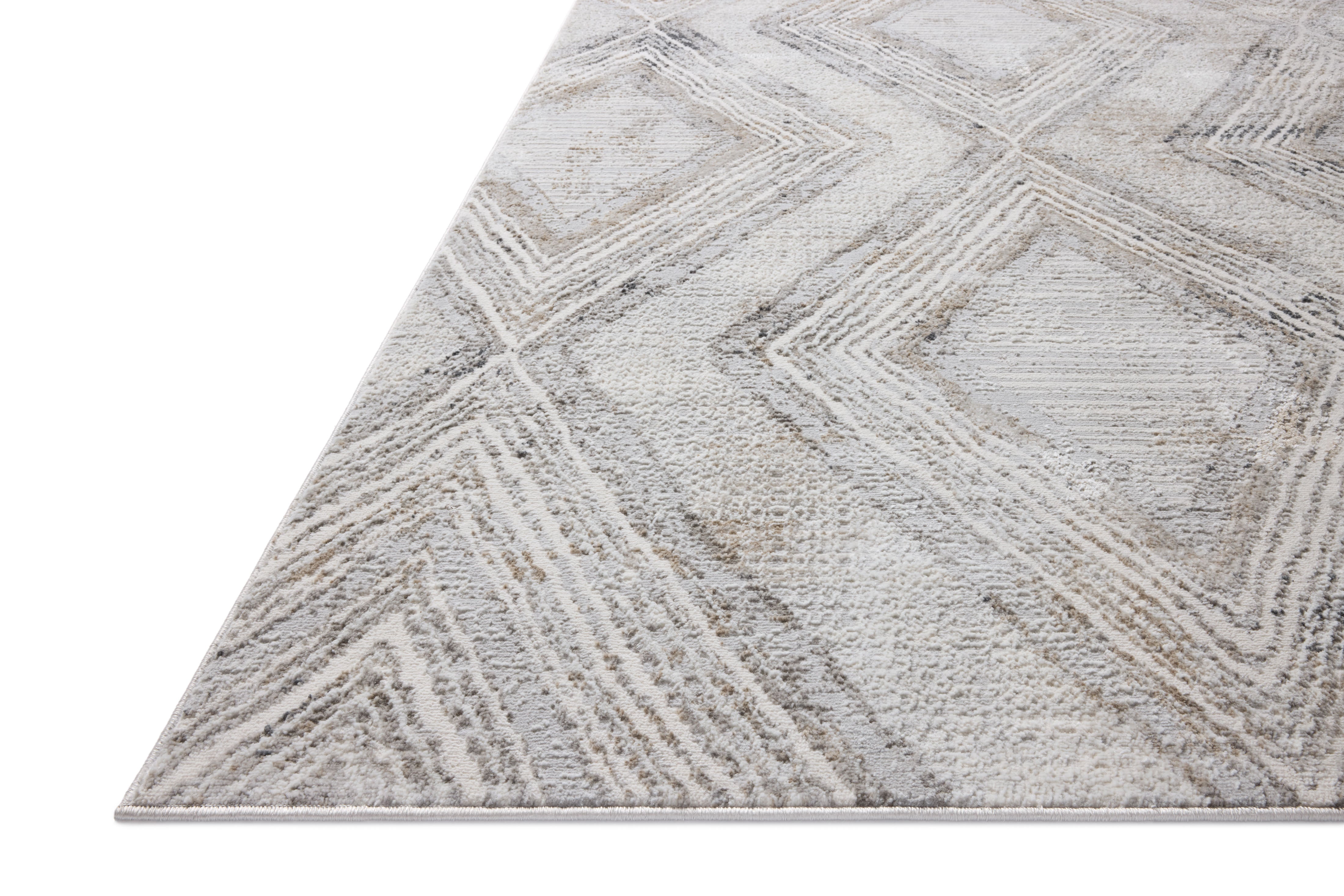 A power-loomed polyester area rug in soft misty and warm natural tones with geometric motifs, the Hollis HOL-05 Mist / Natural Area Rug grounds your room beautifully