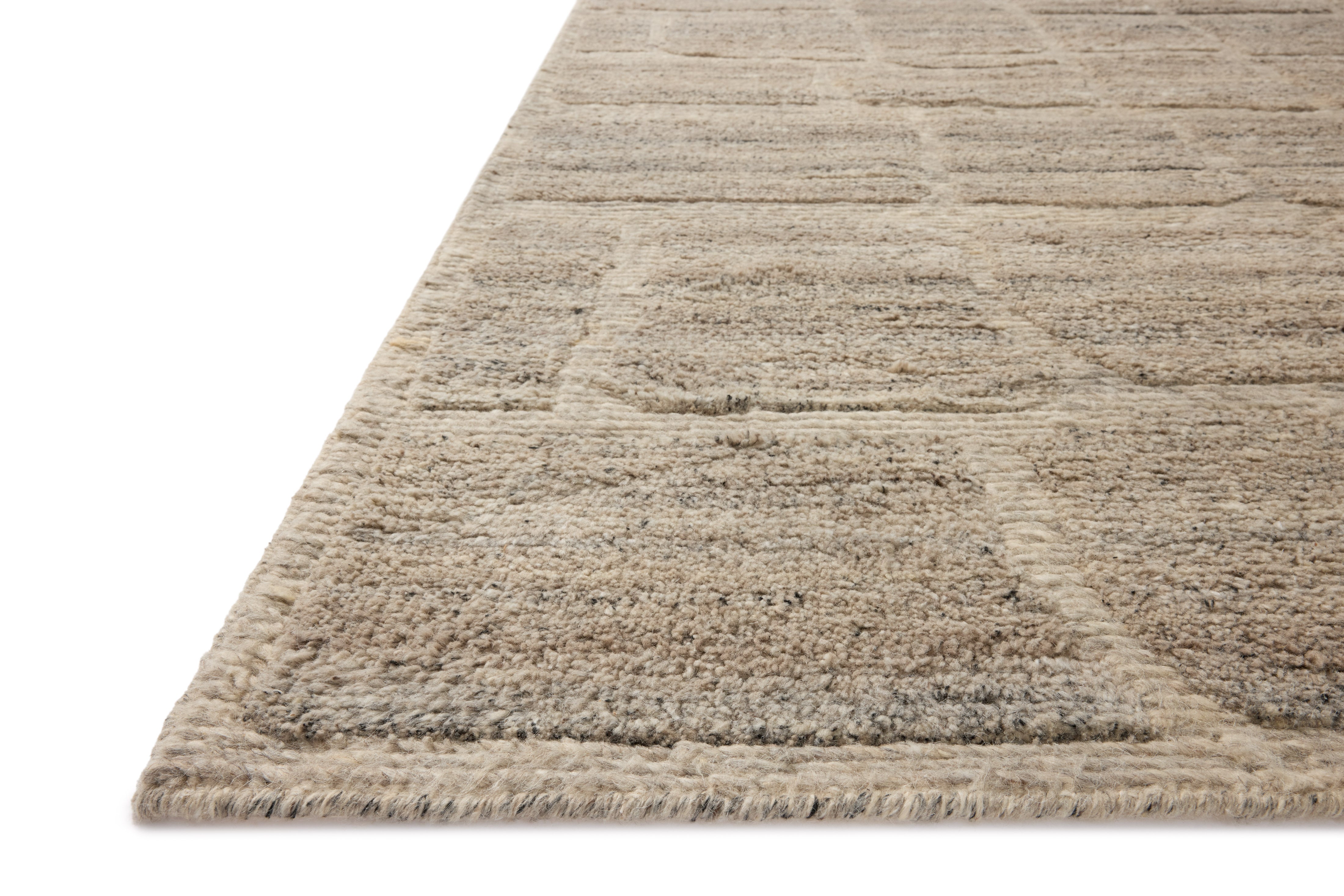 Dressed in gentle dove hues with graphic detail, the Hughes HUS-01 Dove Area Rug is a hand-knotted wool area rug that completes any room