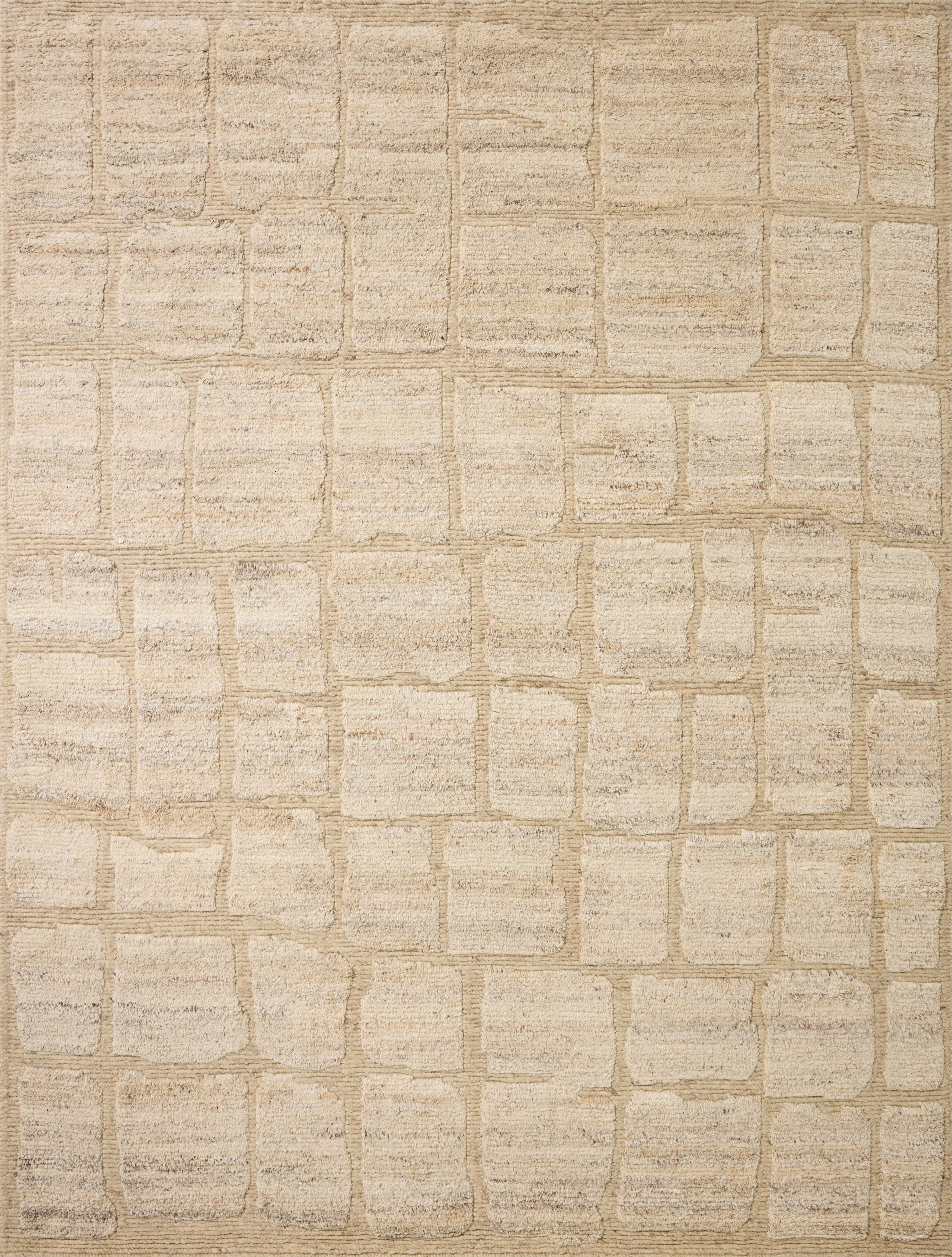 The Hughes HUS-01 Natural Area Rug transforms any space with warm natural tones and graphic design in a hand-knotted wool area rug