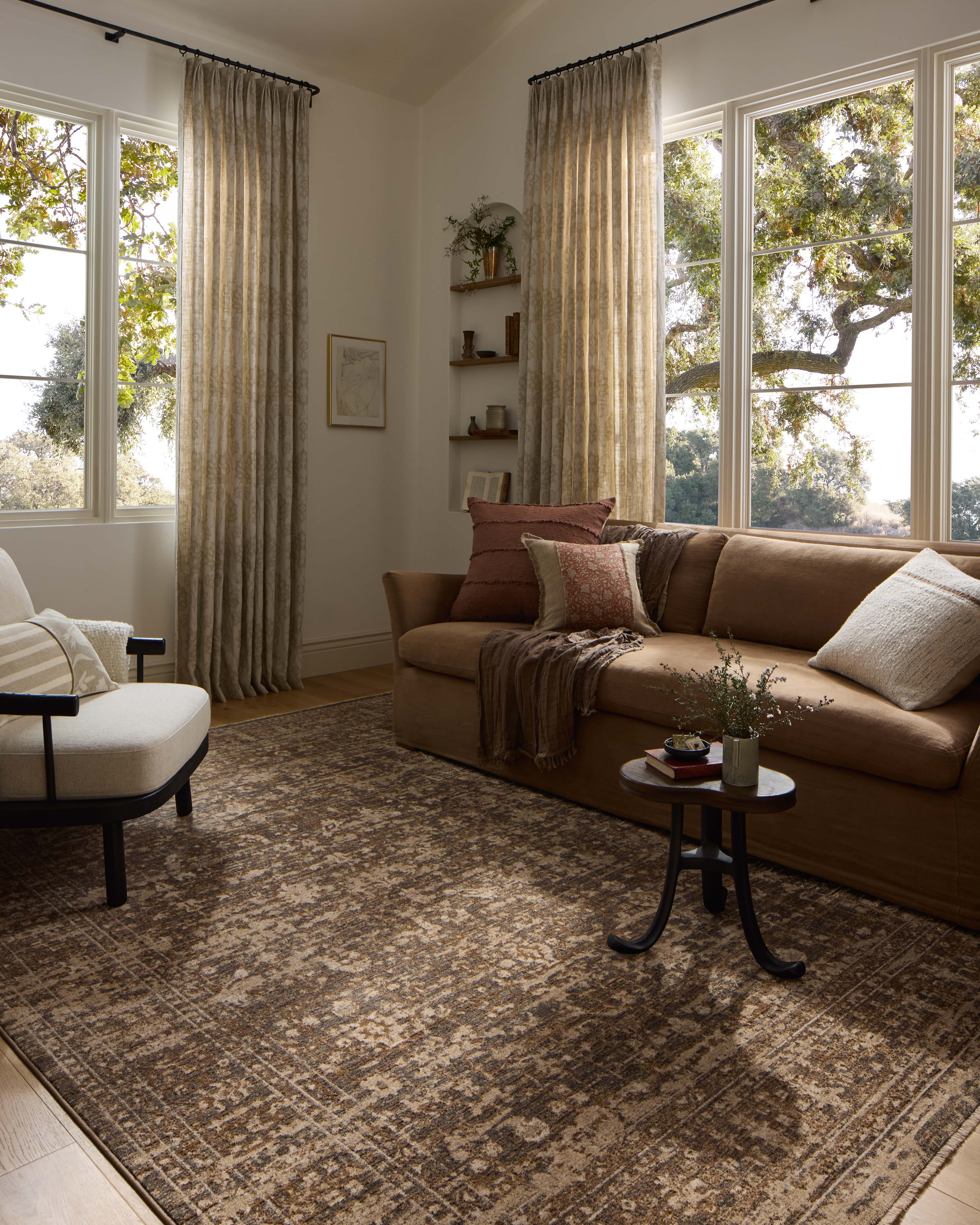 Designed with traditional and distressed artistry in striking granite and warm natural hues, the Haywood HYD-01 Granite / Natural Area Rug is a power-loomed polyester area rug that stands out