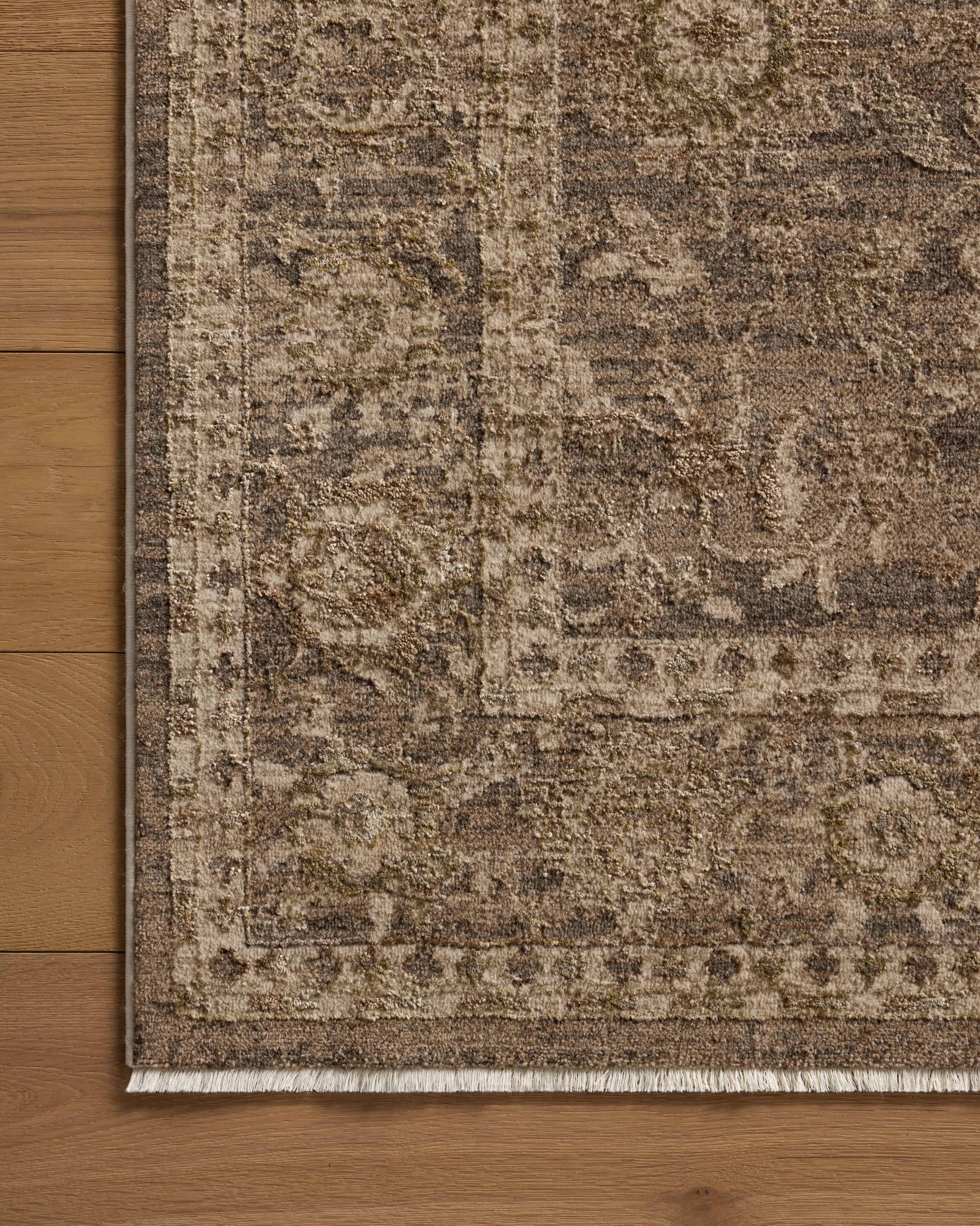 Rich in subtle pebble and deep charcoal hues with traditional and distressed detail, the Haywood HYD-02 Pebble / Charcoal Area Rug is a power-loomed polyester area rug built for style and comfort