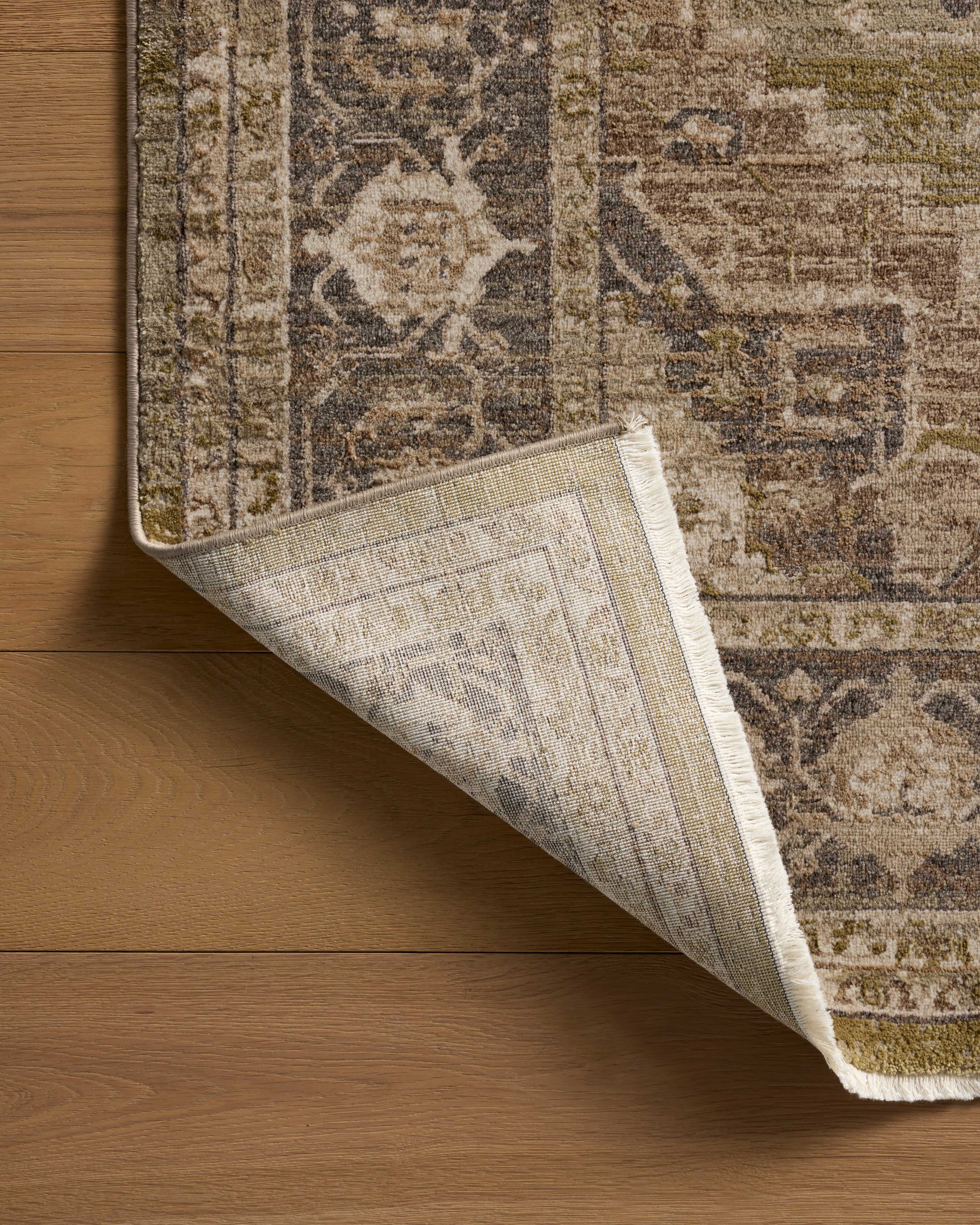 The Haywood HYD-03 Moss / Charcoal Area Rug brings lush moss and deep charcoal character and traditional and distressed flair to your home in a power-loomed polyester area rug