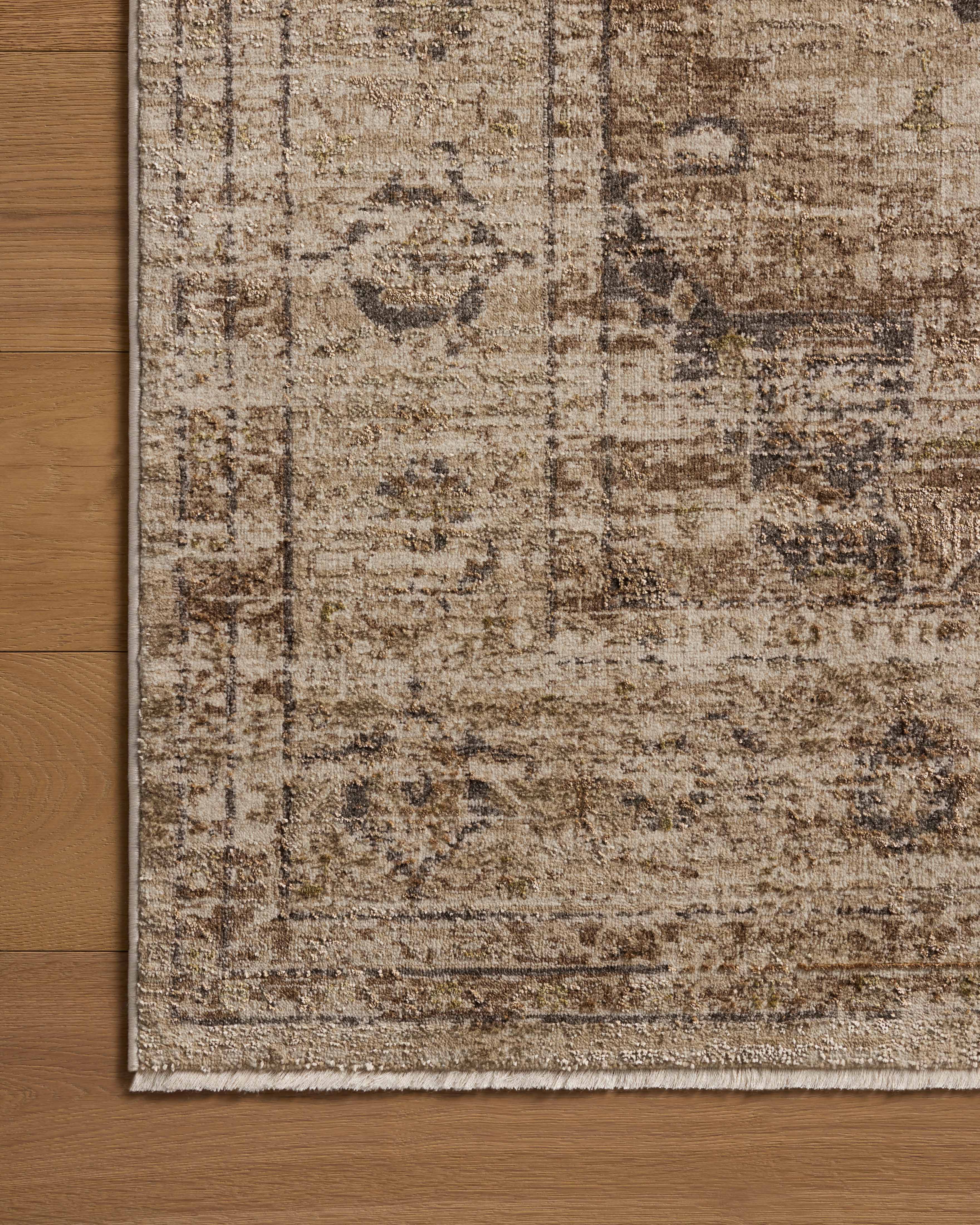 Finished in warm natural and grounded bark tones with traditional and distressed styling, the Haywood HYD-03 Natural / Bark Area Rug is a power-loomed polyester area rug for modern living