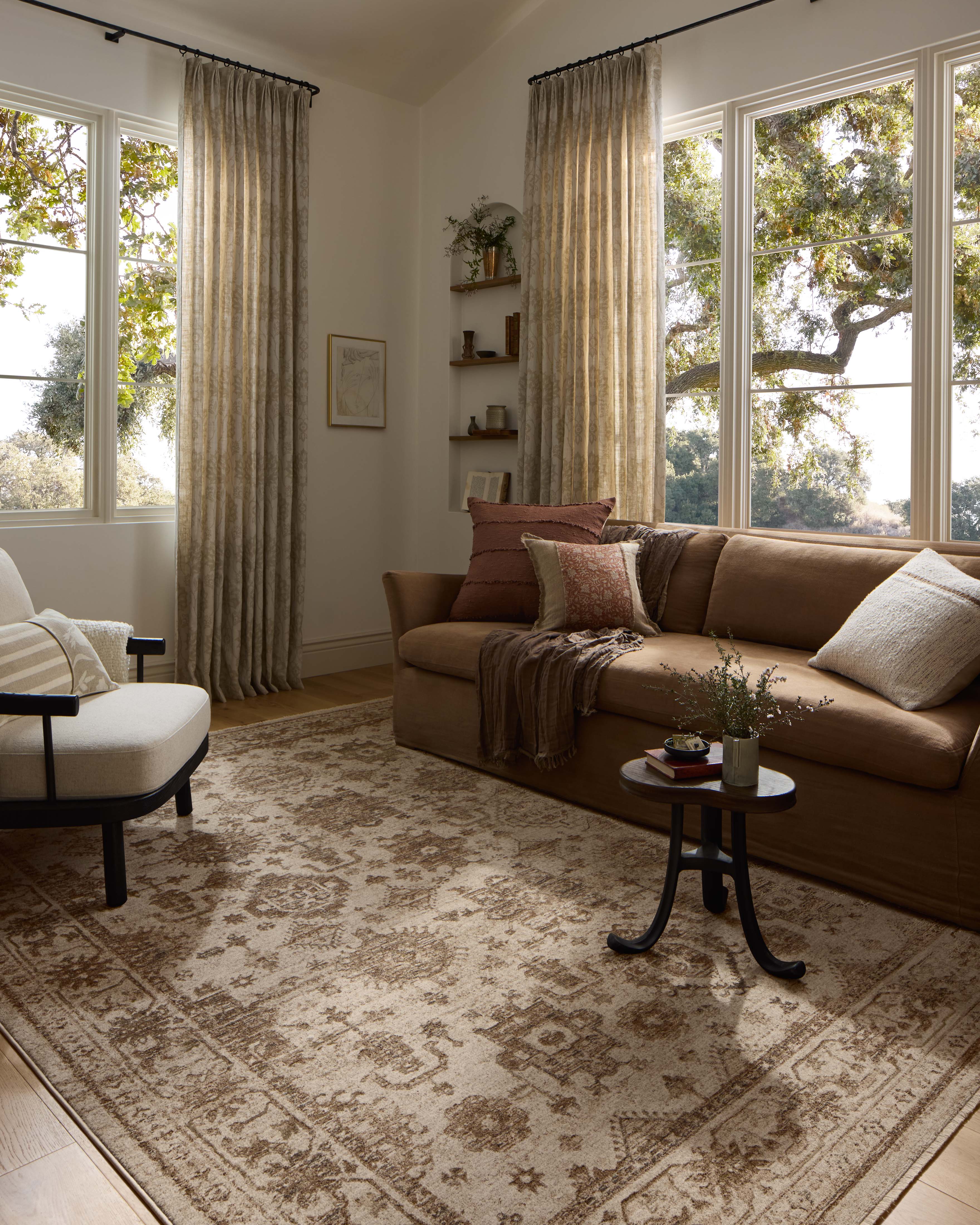 A power-loomed polyester area rug with traditional and distressed design in refined ivory and versatile taupe hues, the Haywood HYD-04 Ivory / Taupe Area Rug is a standout in any décor
