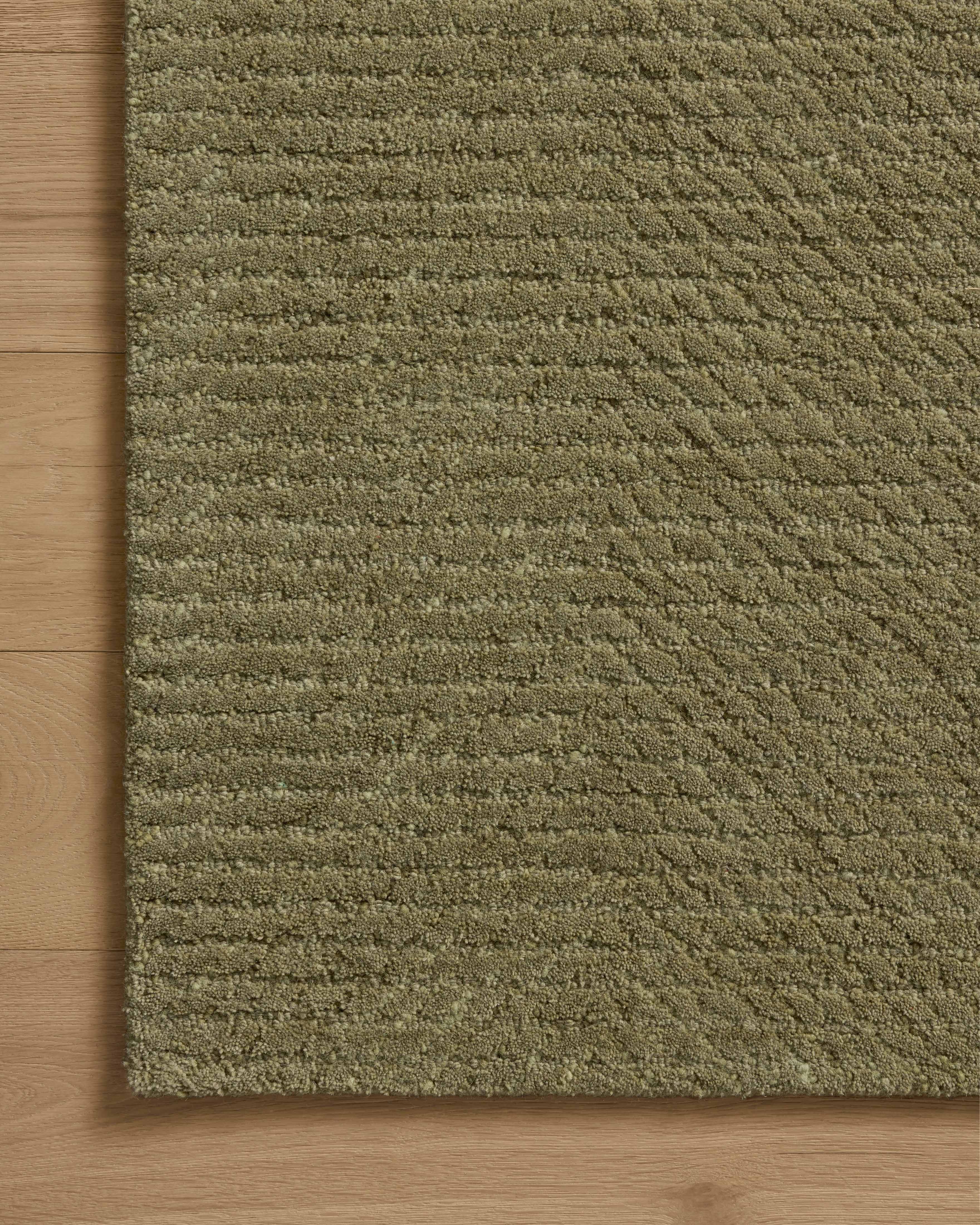 A hand-tufted wool area rug with ribbed design in earthy olive hues, the Kai KAI-01 Olive Area Rug is a standout in any décor