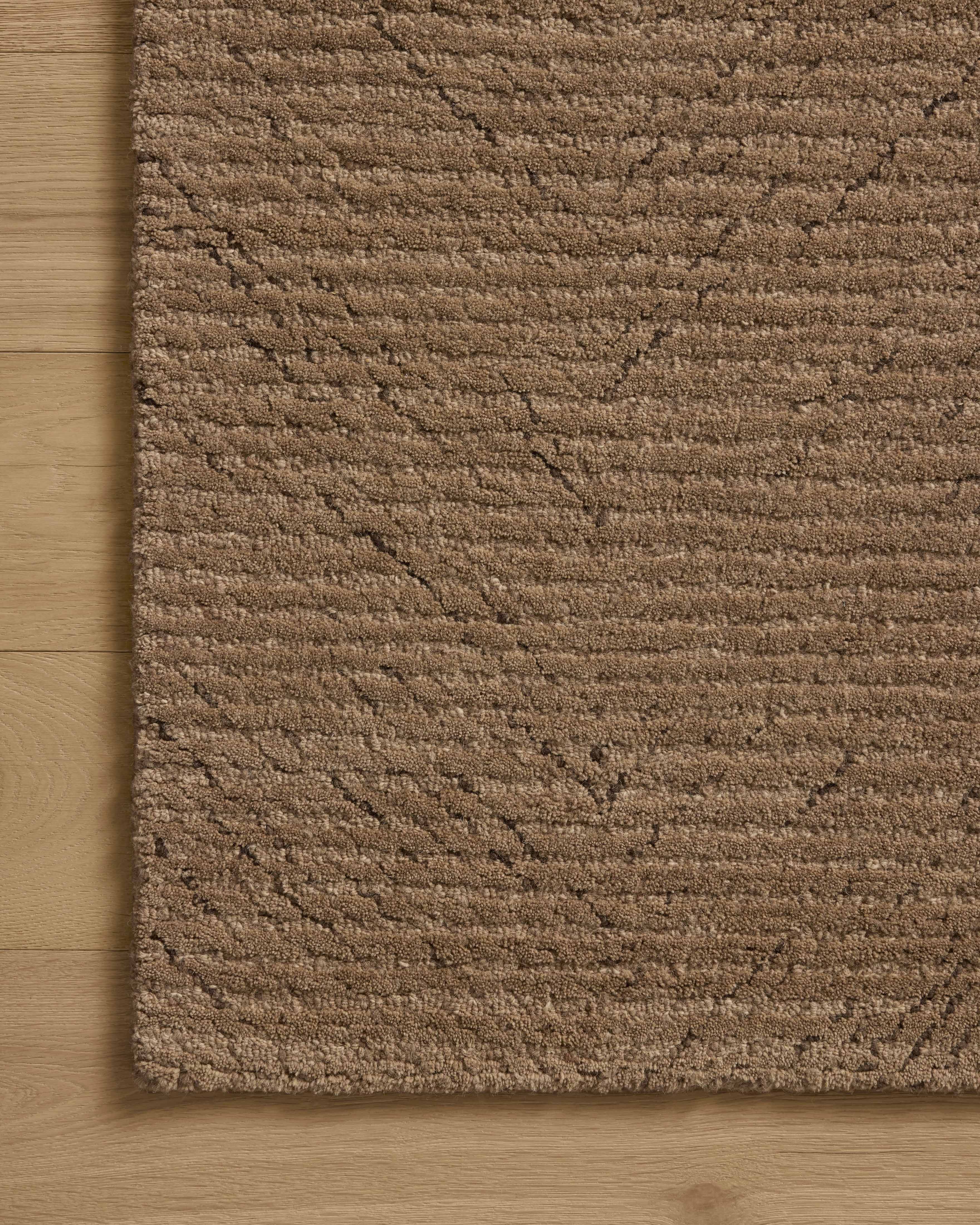 The Kai KAI-01 Pebble Area Rug highlights subtle pebble tones and ribbed texture in a beautifully made hand-tufted wool area rug