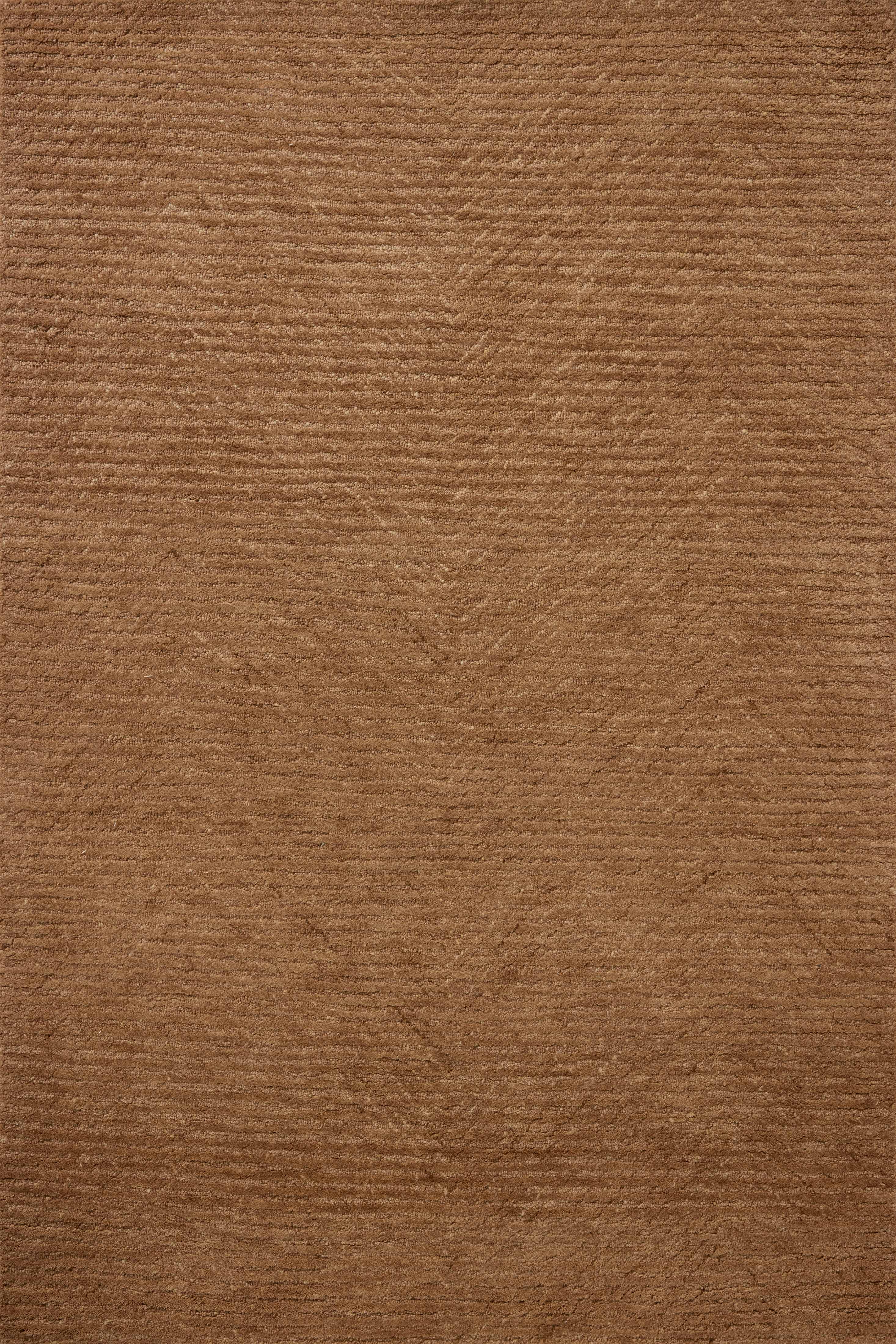 Dressed in rich terracotta hues with ribbed detail, the Kai KAI-01 Terracotta Area Rug is a hand-tufted wool area rug that completes any room