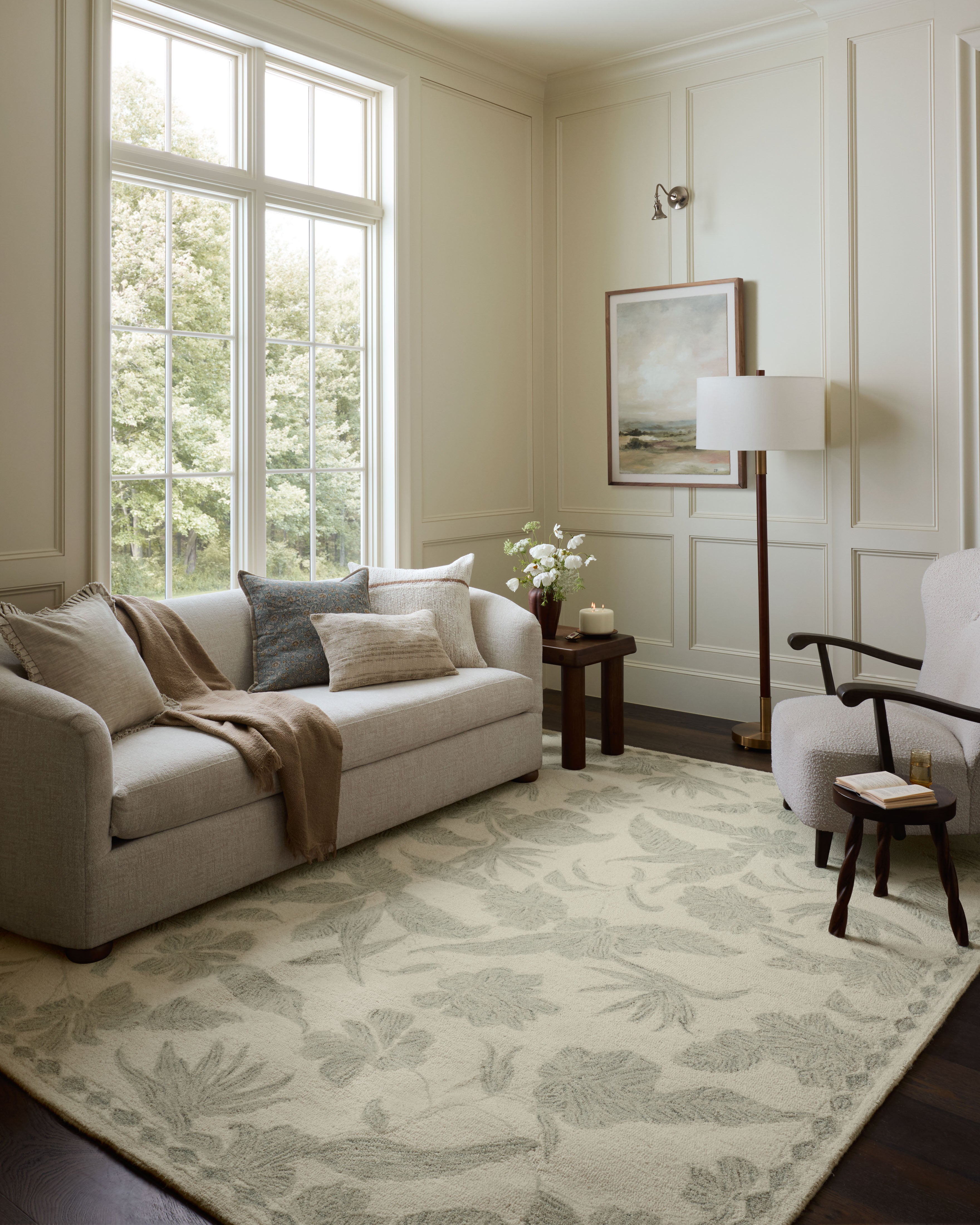 Crafted as a hand-tufted wool area rug, the Lenore LNO-01 Ivory / Sky Area Rug brings refined ivory and breezy sky-blue warmth and floral character to your space