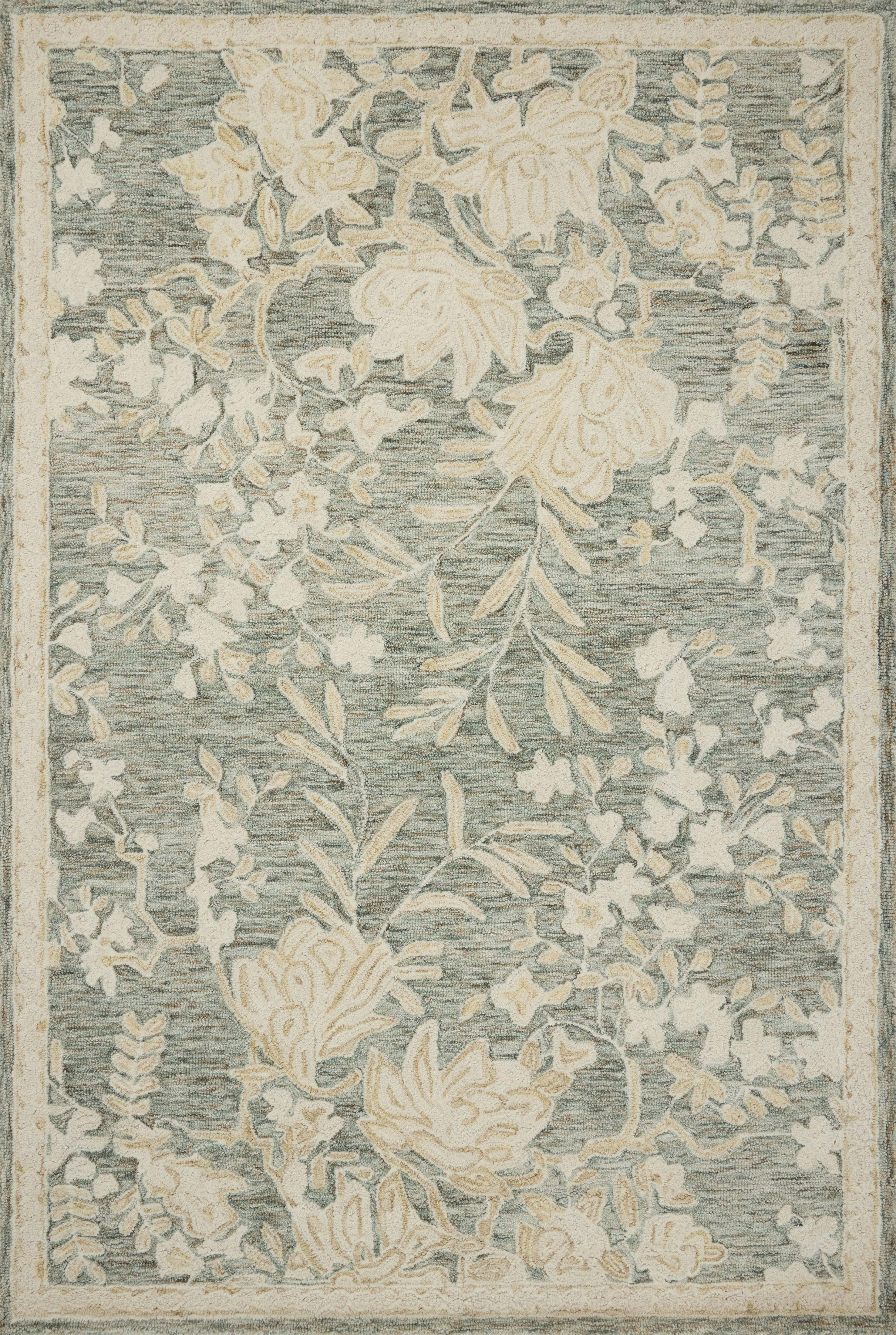 The Lenore LNO-02 Lagoon / Wheat Area Rug blends tranquil lagoon and golden wheat tones and floral motifs into a hand-tufted wool area rug with timeless appeal
