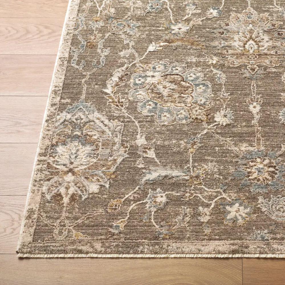 Close-up of the Arda ACZ-2300 medium gray area rug with intricate floral patterns and fringe edge.
