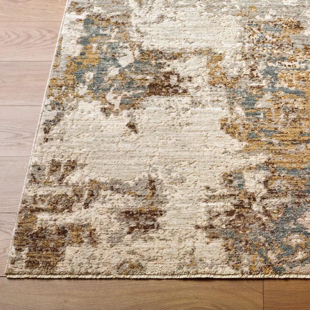 Close-up of the Arda ACZ-2303 light gray area rug with an abstract pattern in gold, blue, and brown tones.