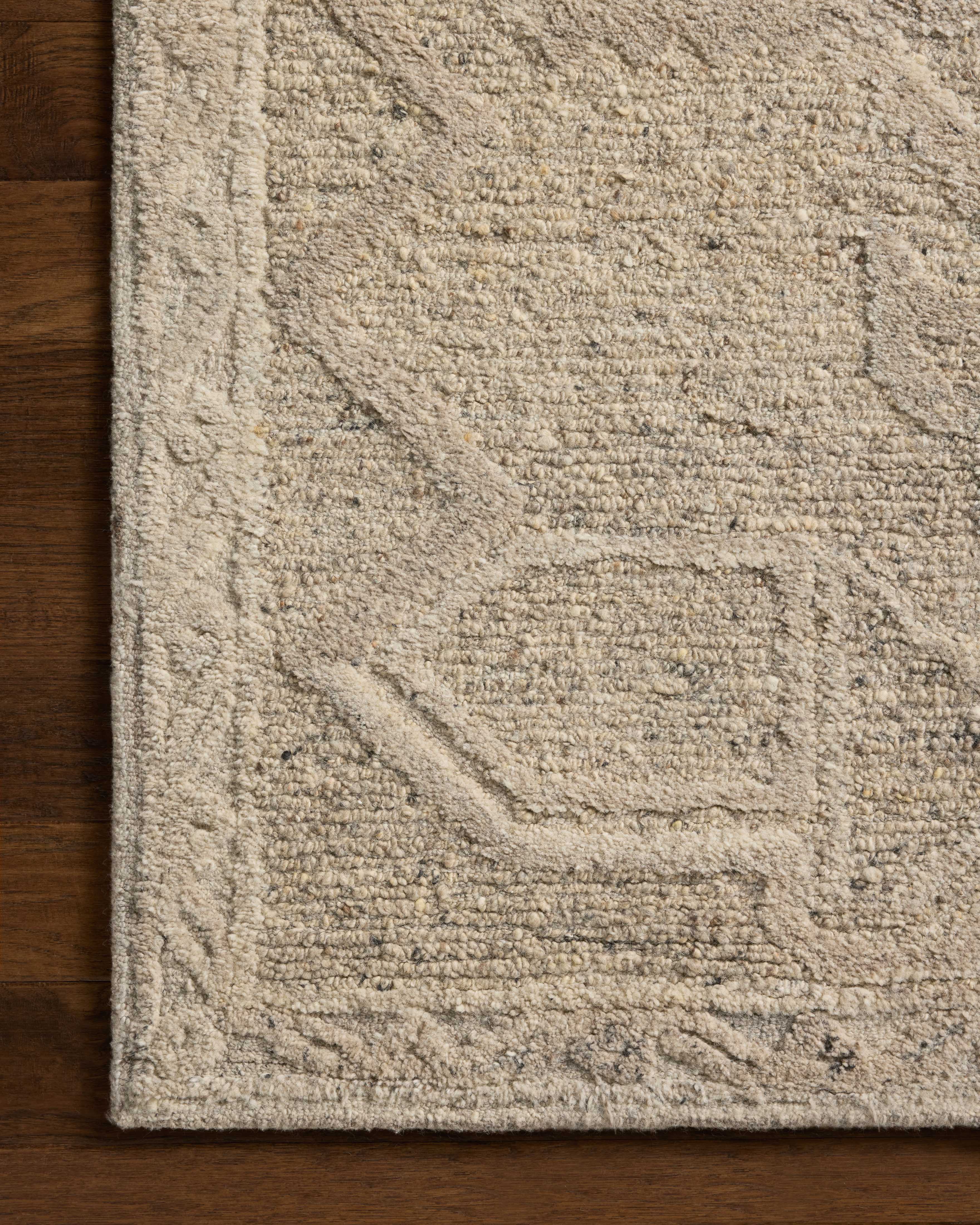 Rich in subtle pebble and soft misty hues with traditional detail, the Mabel MBL-01 Pebble / Mist Area Rug is a hand-tufted wool area rug built for style and comfort