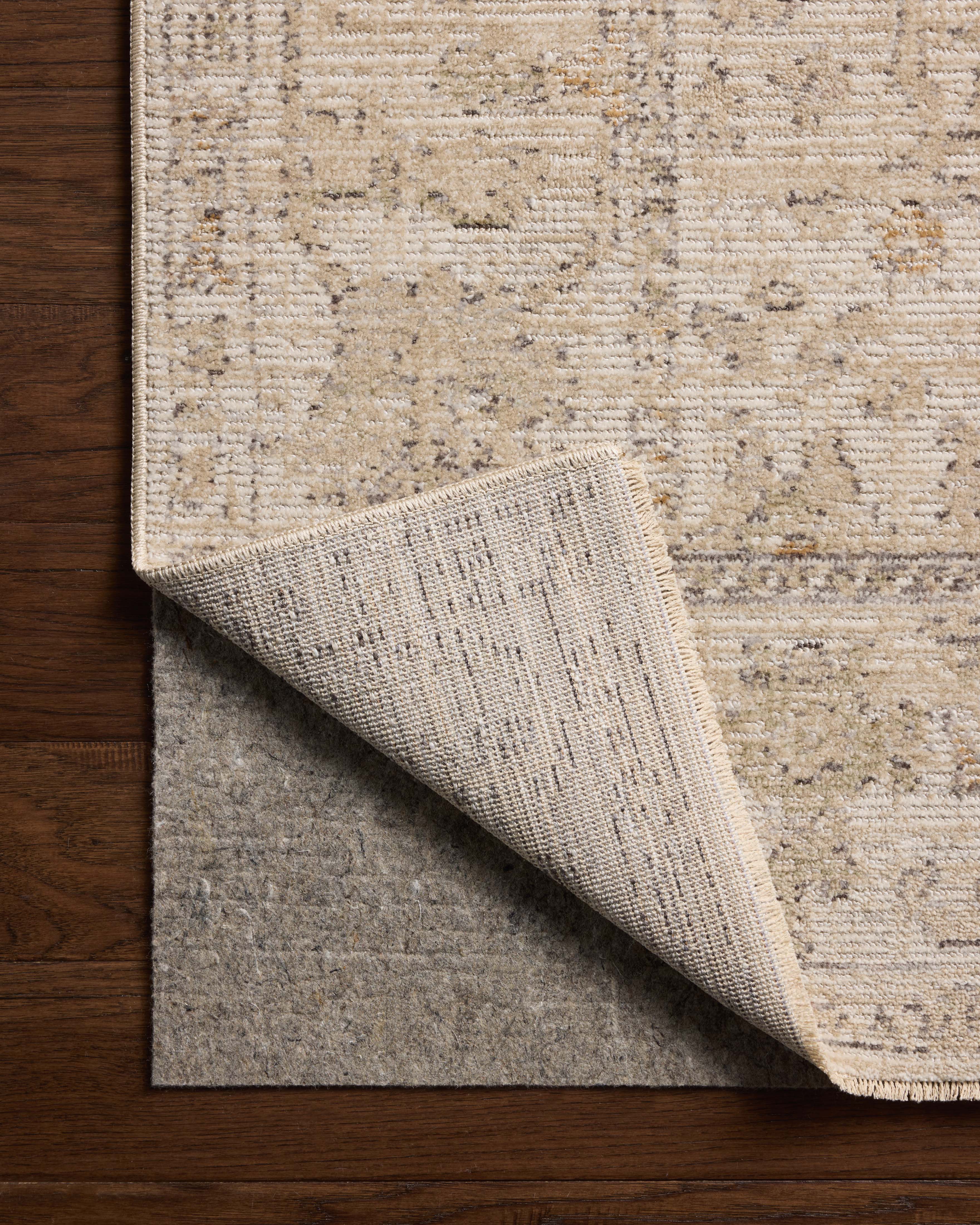 Loloi Milena MLE?08 ivory and sand vintage?inspired area rug with soft neutral tones and textured pattern