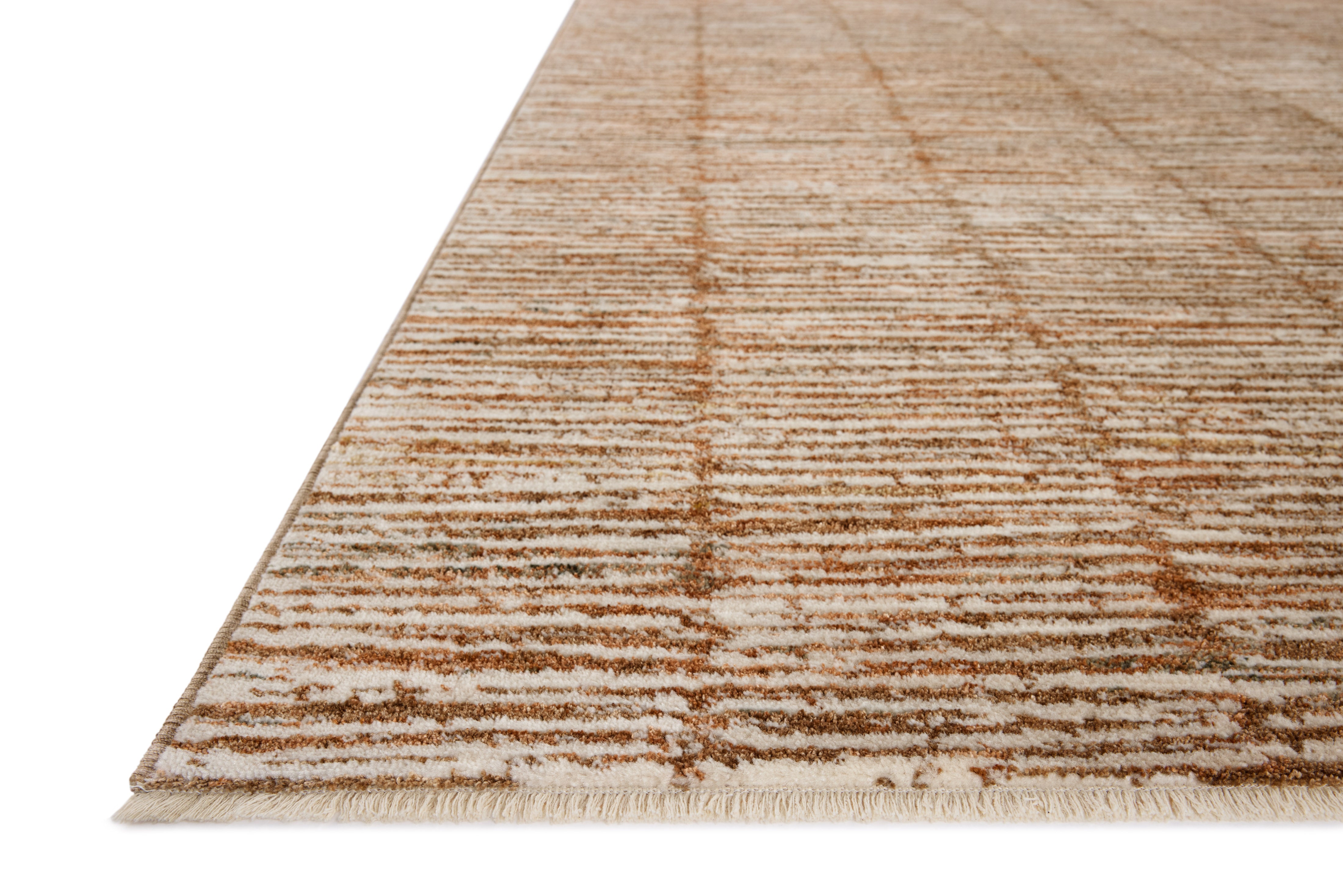 Featuring rich terracotta and refined ivory hues and graphic detail, the Nellie NEL-01 Terracotta / Ivory Area Rug is a power-loomed polyester and polypropylene area rug for any room