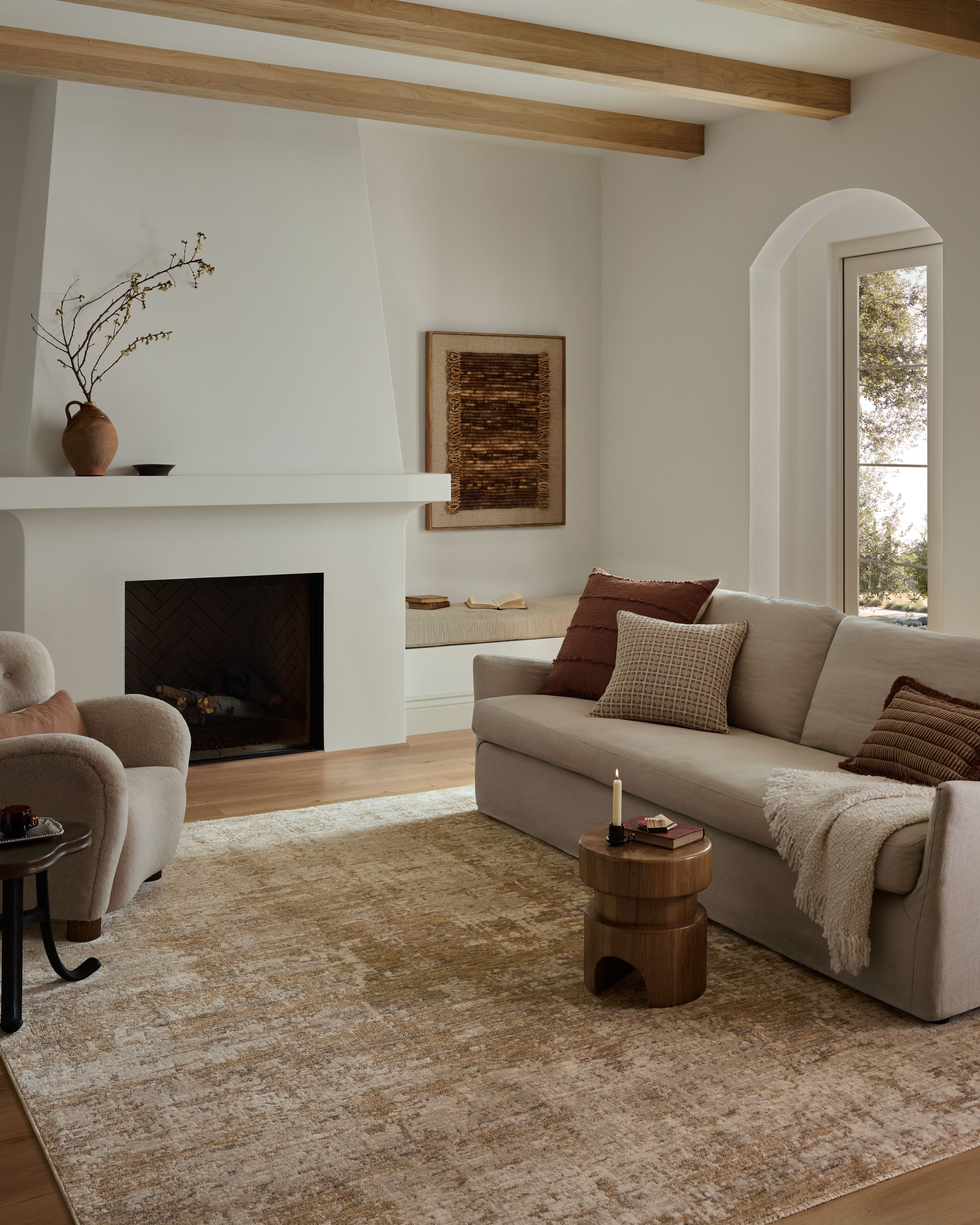 Crafted as a power-loomed polyester and polypropylene area rug, the Nellie NEL-03 Stone / Taupe Area Rug brings grounding stone and versatile taupe warmth and graphic character to your space
