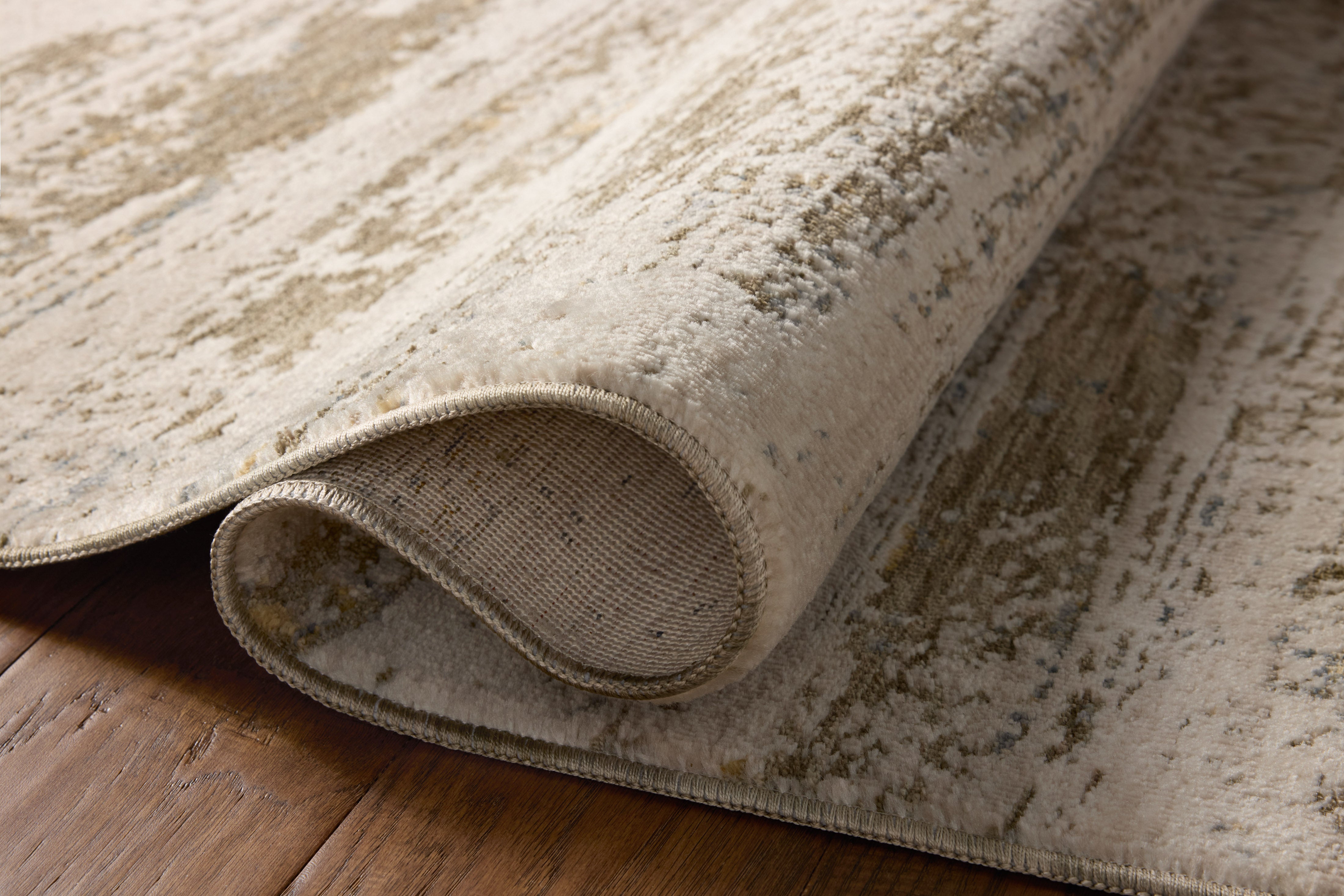 A stunning power-loomed polyester and polypropylene area rug with graphic detail, the Nellie NEL-04 Lagoon / Dove Area Rug features tranquil lagoon and gentle dove tones for a polished look