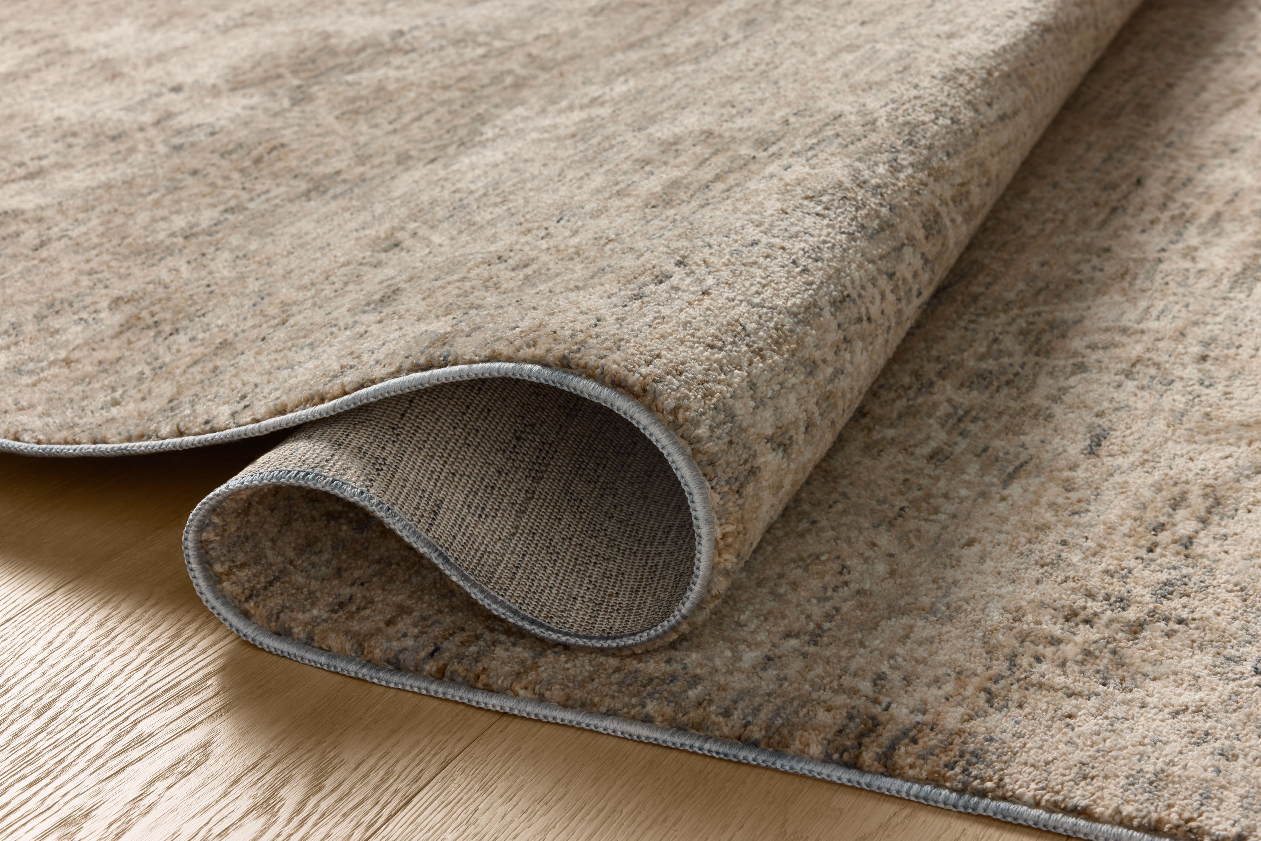 Dressed in cool slate and warm natural hues with vintage and distressed detail, the Newman NEW-01 Slate / Natural Area Rug is a power-loomed polyester area rug that completes any room