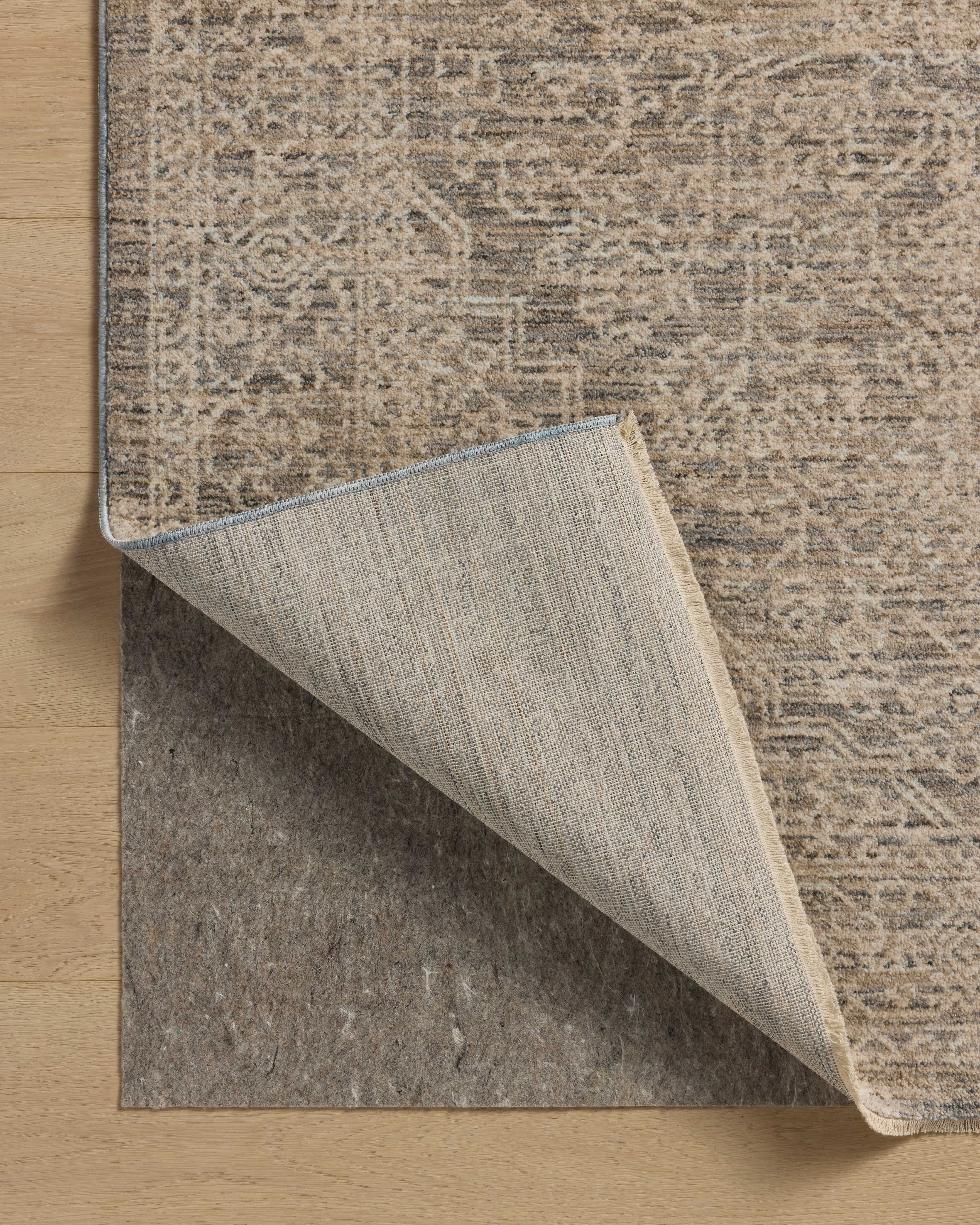 Dressed in cool slate and warm natural hues with vintage and distressed detail, the Newman NEW-01 Slate / Natural Area Rug is a power-loomed polyester area rug that completes any room