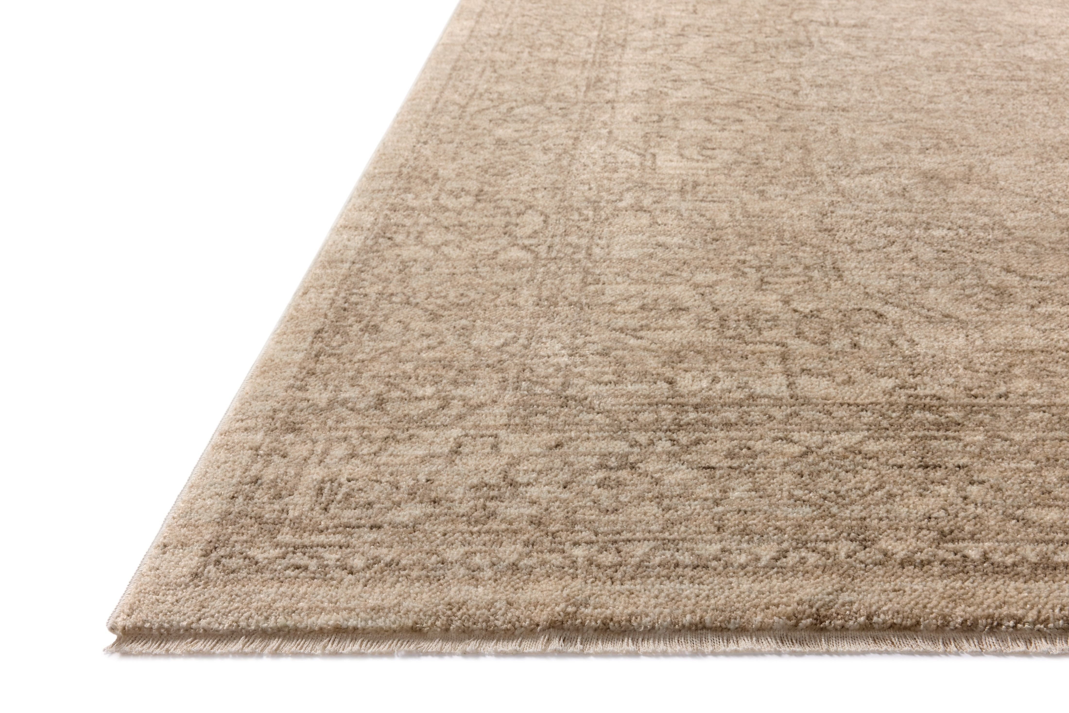 The Newman NEW-01 Taupe / Bone Area Rug transforms any space with versatile taupe and bone tones and vintage and distressed design in a power-loomed polyester area rug