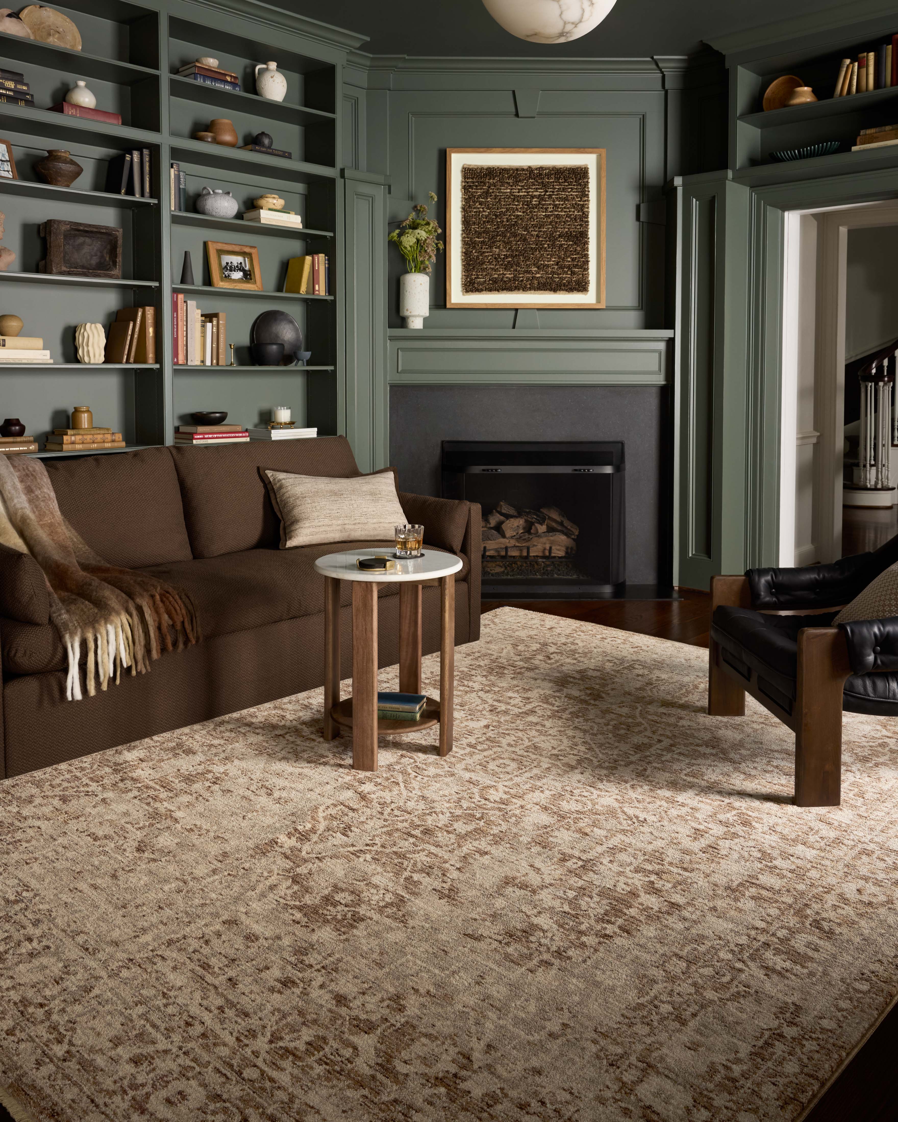 A power-loomed polyester area rug in grounded bark and warm natural tones with vintage and distressed motifs, the Newman NEW-02 Bark / Natural Area Rug grounds your room beautifully