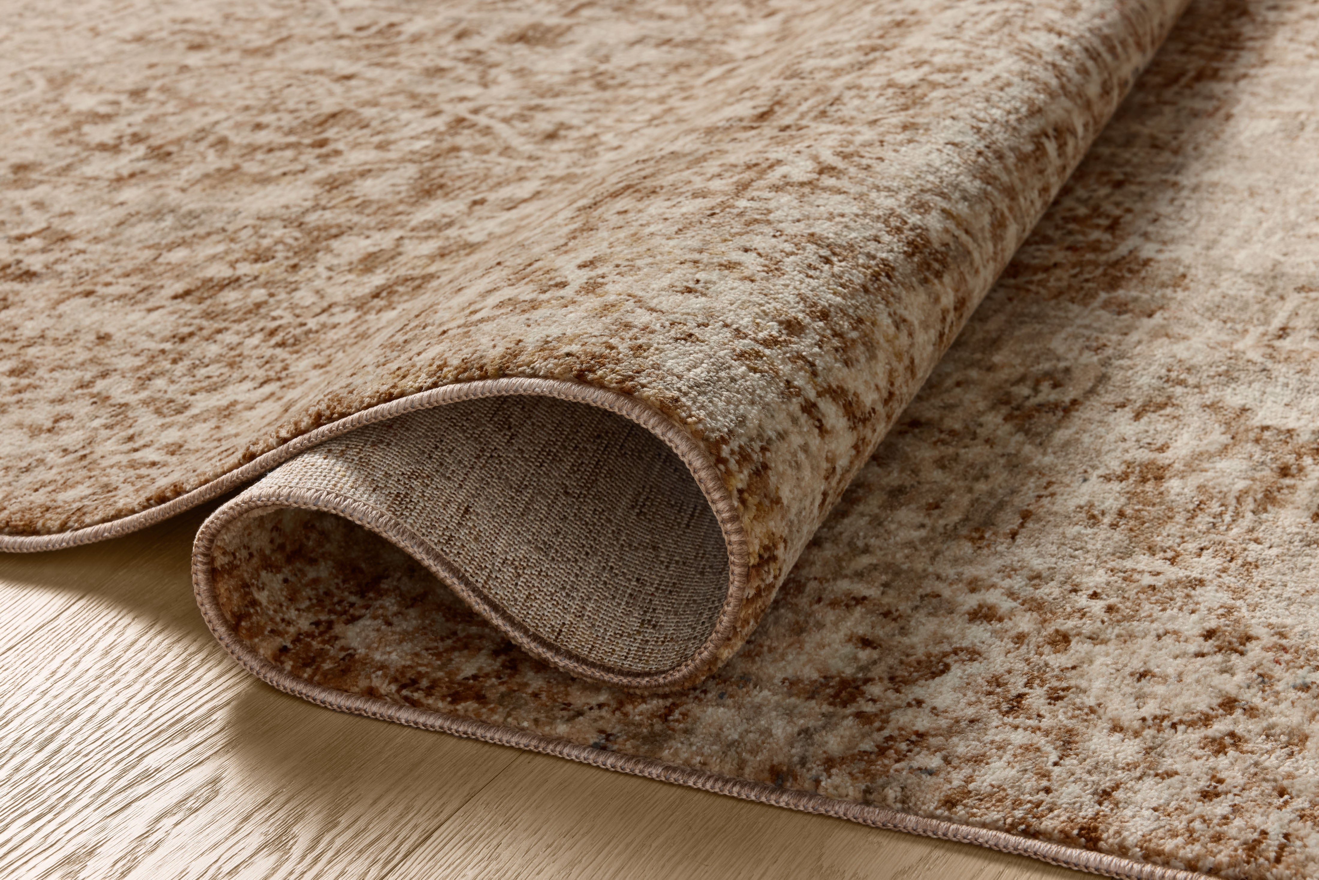 A power-loomed polyester area rug in grounded bark and warm natural tones with vintage and distressed motifs, the Newman NEW-02 Bark / Natural Area Rug grounds your room beautifully