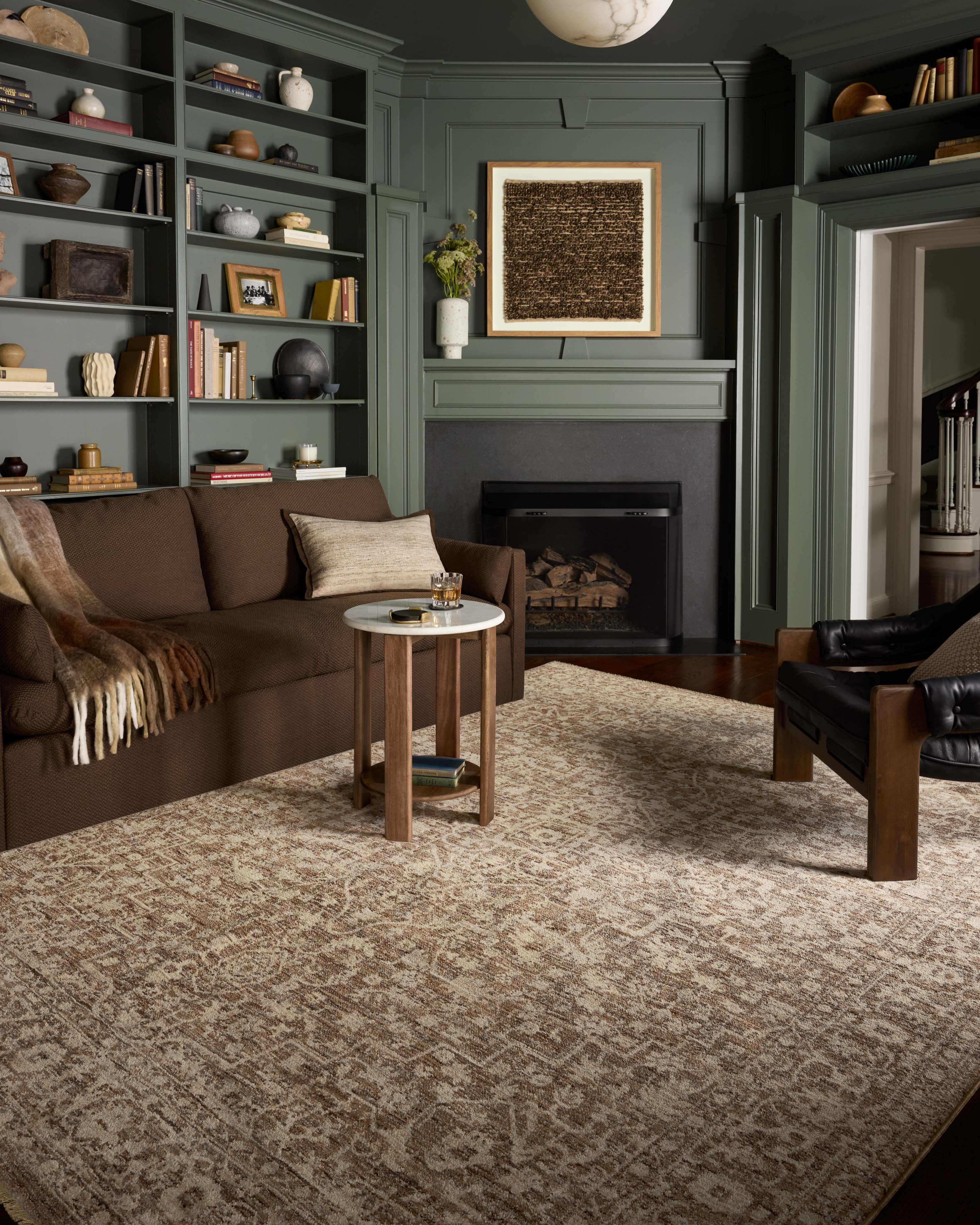 The Newman NEW-02 Dark Taupe / Natural Area Rug is a power-loomed polyester area rug that radiates dark taupe and warm natural charm and vintage and distressed elegance