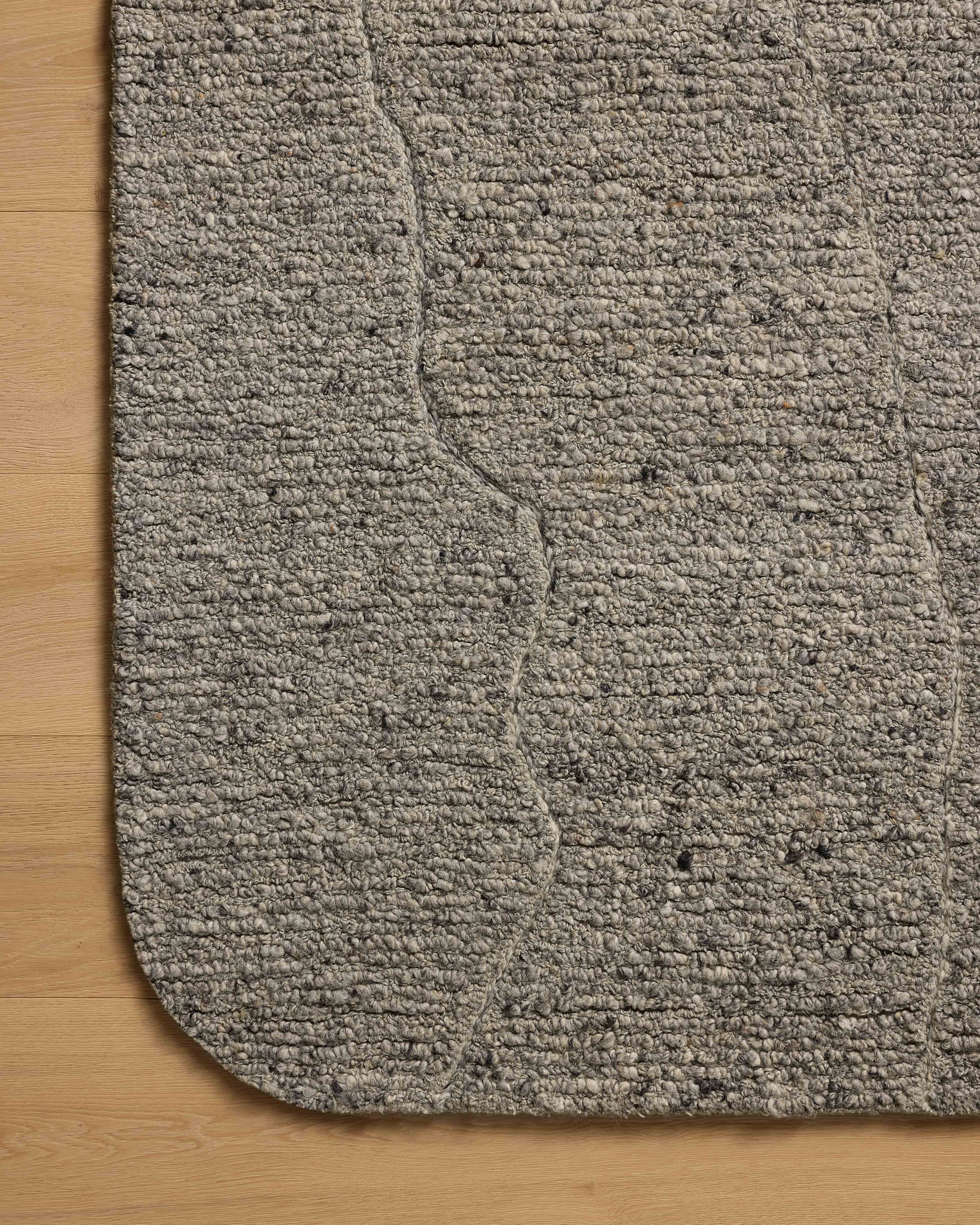 With soft misty and elegant grey hues and linear styling, the Otis OTT-03 Mist / Grey Area Rug is a hand-tufted wool area rug that elevates any room