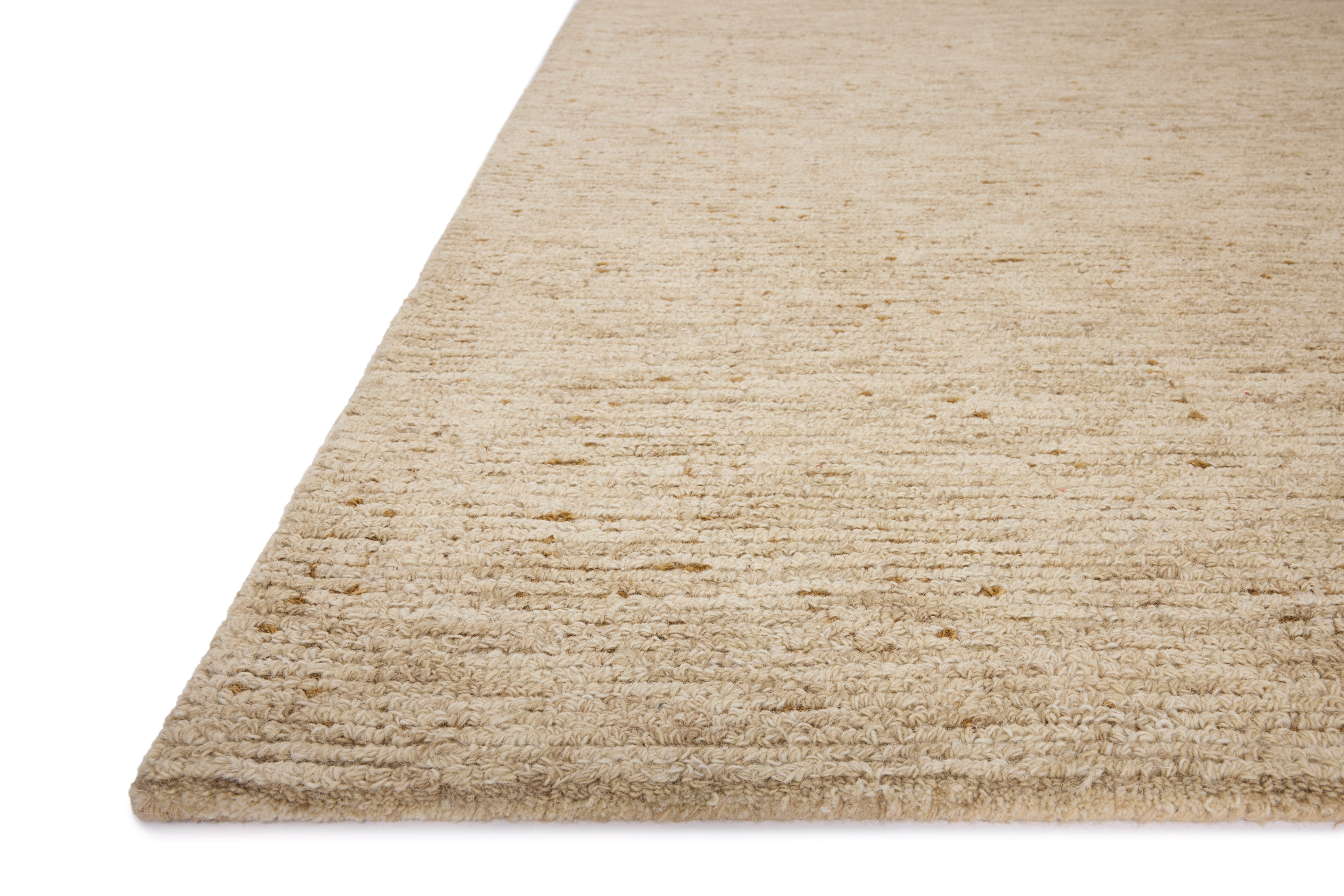 The Penny PEN-01 Gold / Natural Area Rug is a hand-tufted wool area rug that radiates radiant gold and warm natural charm and ribbed and high-low textured elegance