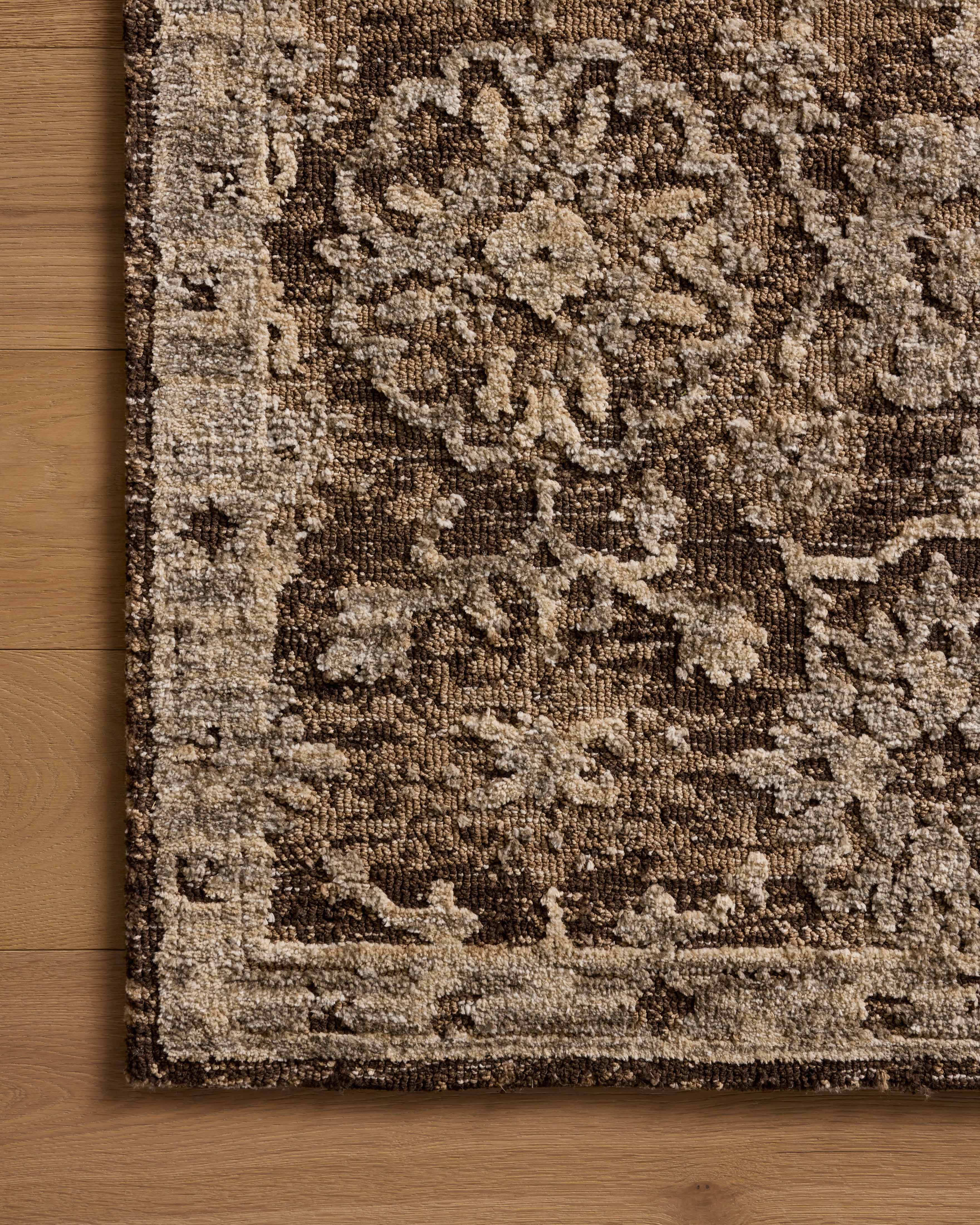 The Percival PCV-02 Bark / Pebble Area Rug highlights grounded bark and subtle pebble tones and traditional texture in a beautifully made power-loomed polyester area rug