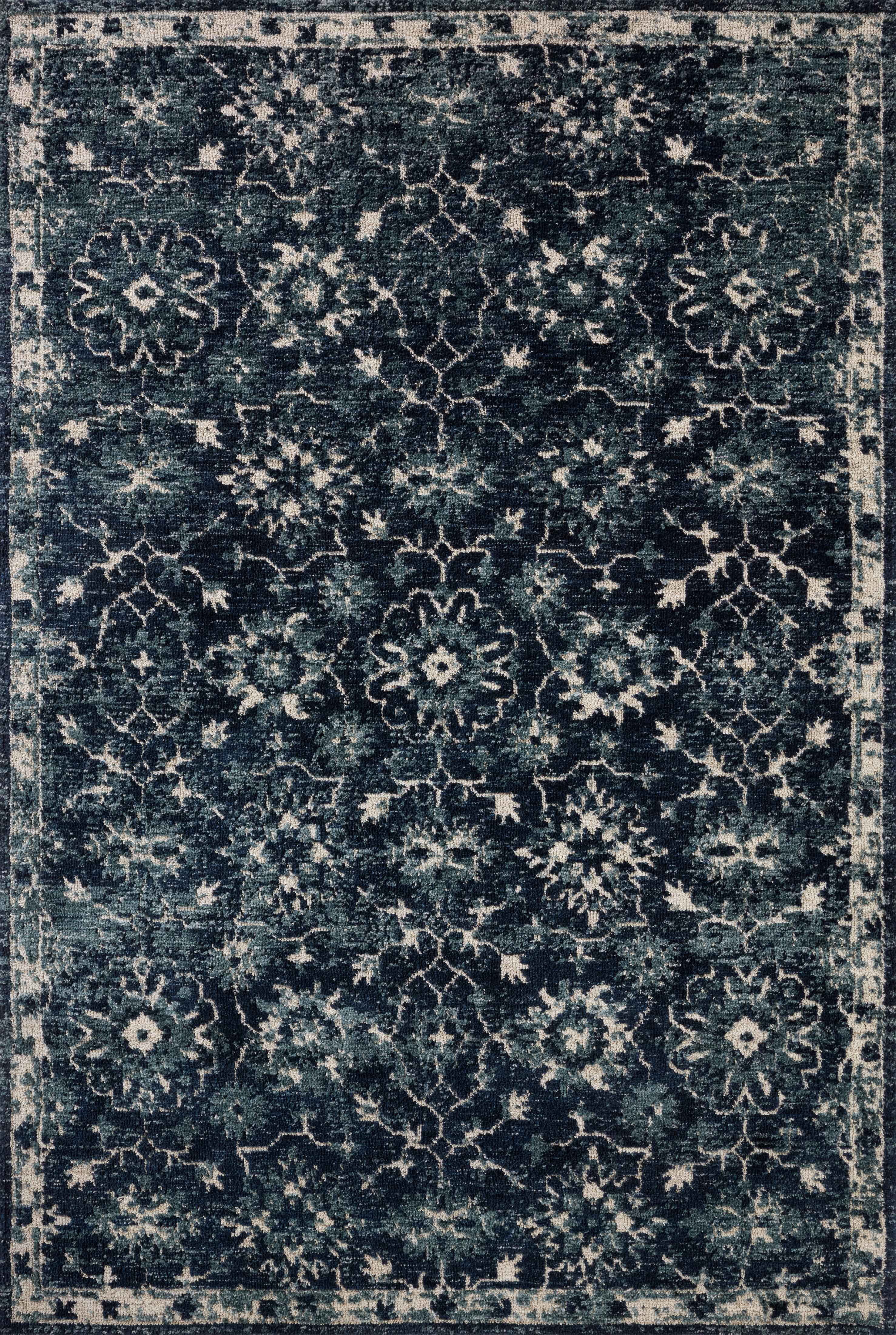 Dressed in classic navy and refined ivory hues with traditional detail, the Percival PCV-02 Navy / Ivory Area Rug is a power-loomed polyester area rug that completes any room