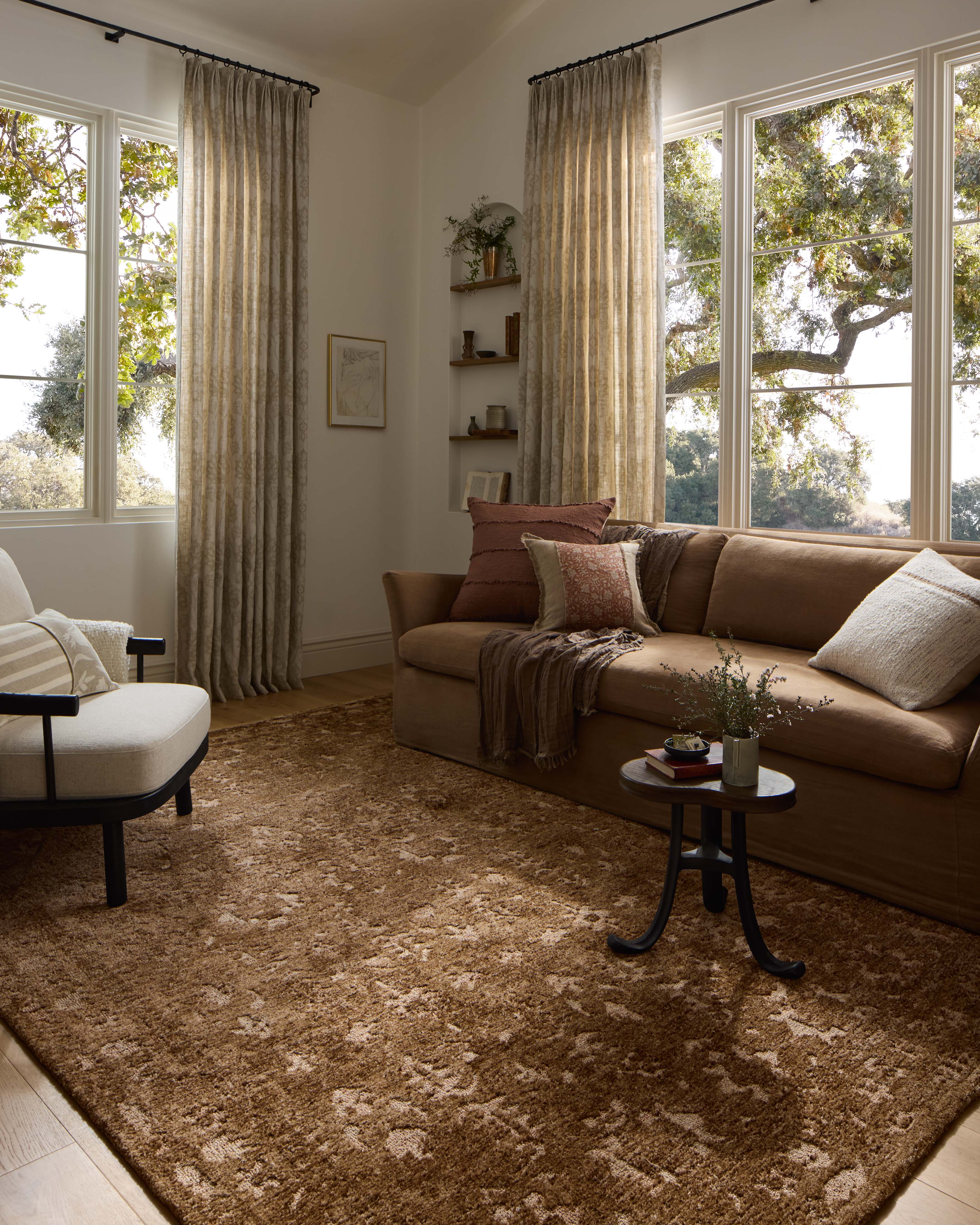 The Percival PCV-03 Mocha / Sand Area Rug transforms any space with luxurious mocha and sandy tones and traditional design in a power-loomed polyester area rug