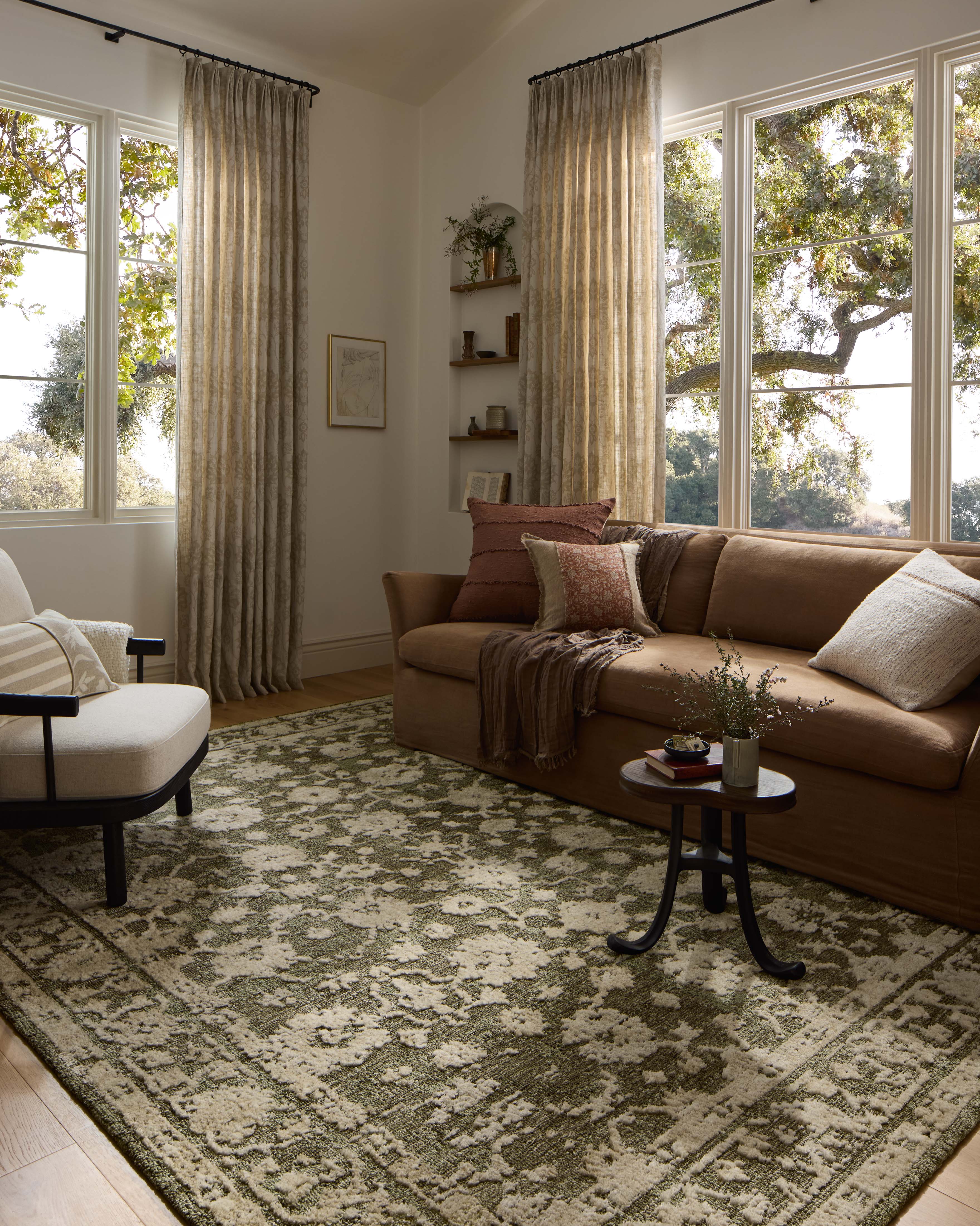 The Percival PCV-06 Moss / Natural Area Rug brings lush moss and warm natural character and traditional flair to your home in a power-loomed polyester area rug
