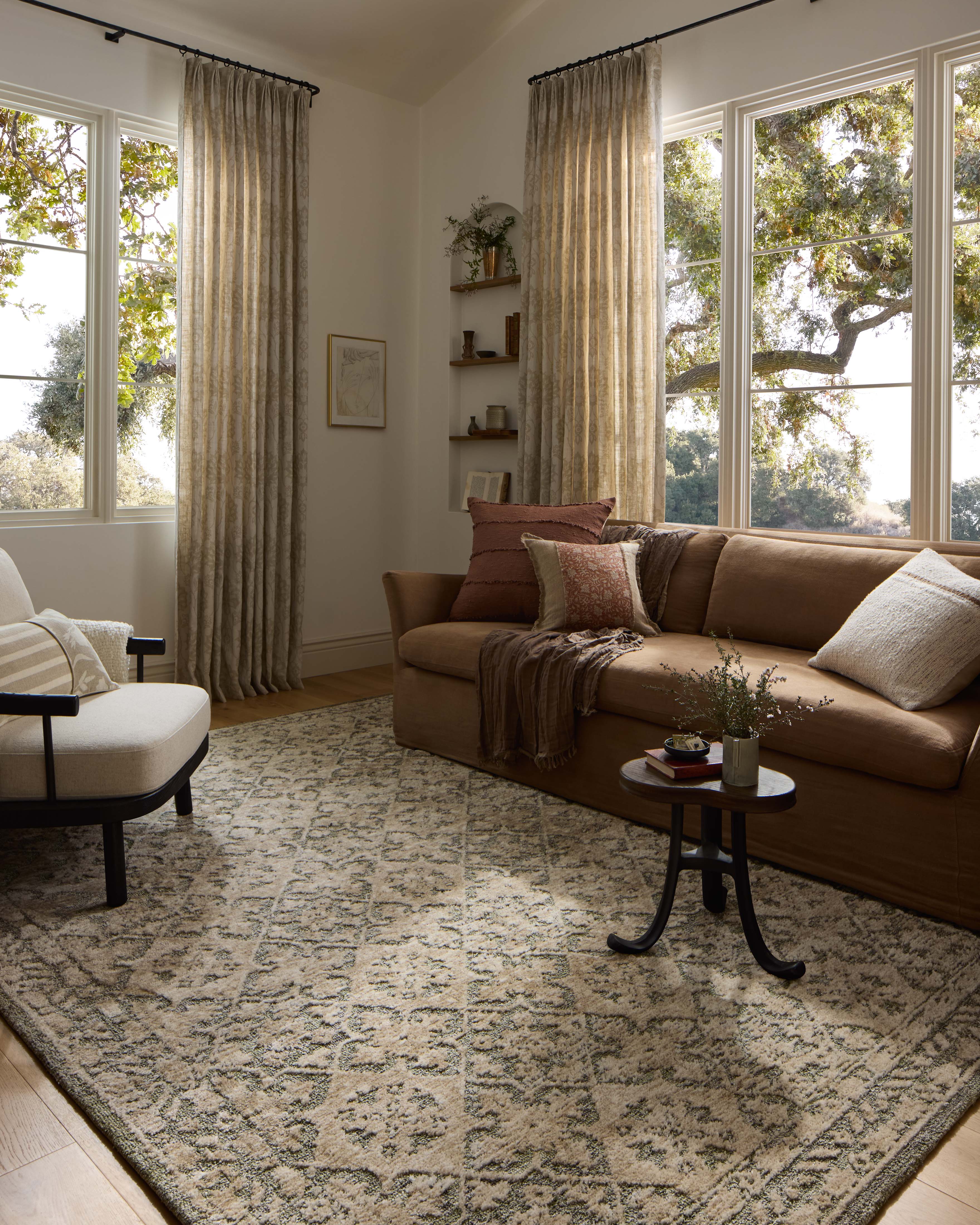 Finished in calming sage and grounding stone tones with traditional styling, the Percival PCV-07 Sage / Stone Area Rug is a power-loomed polyester area rug for modern living
