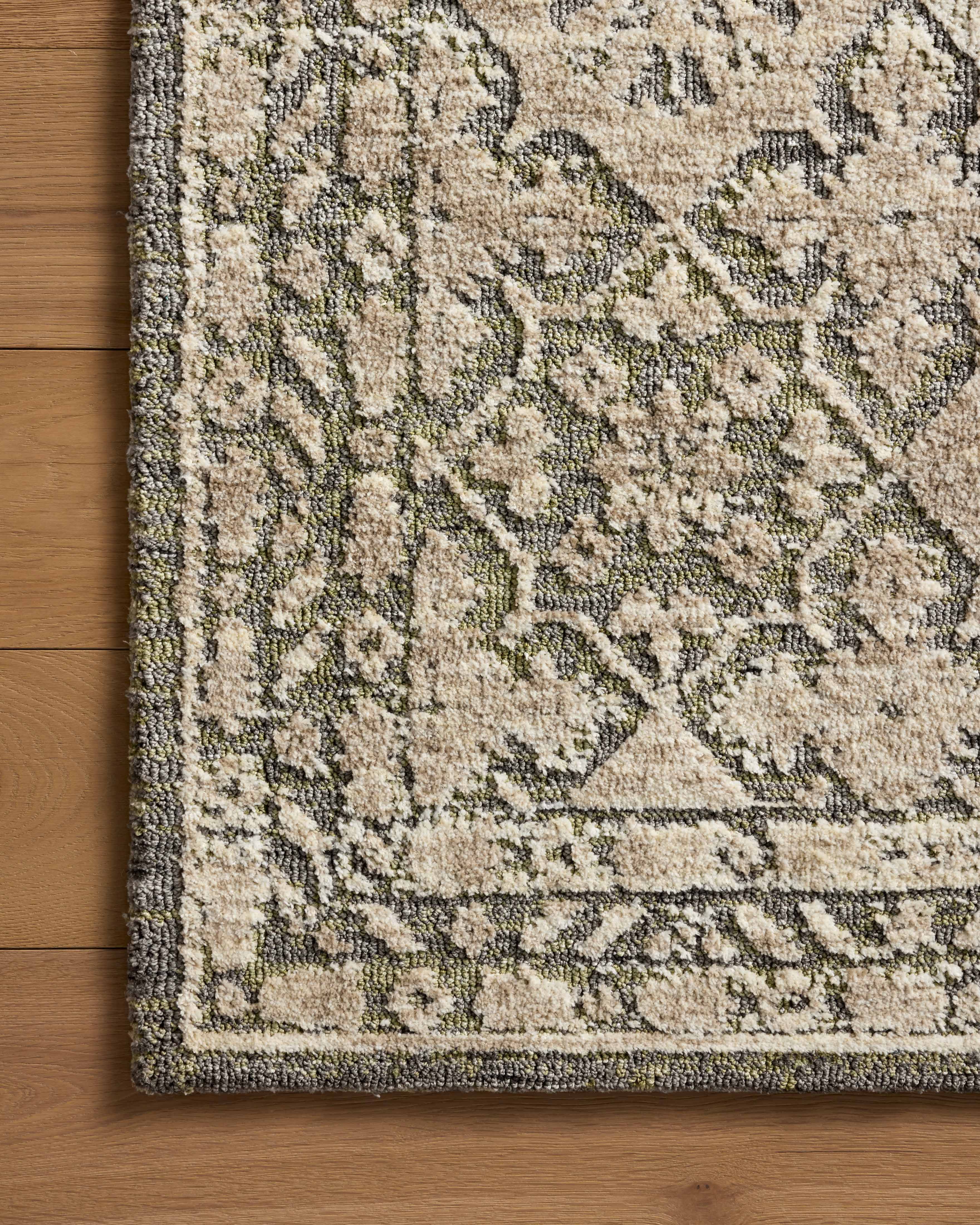 Finished in calming sage and grounding stone tones with traditional styling, the Percival PCV-07 Sage / Stone Area Rug is a power-loomed polyester area rug for modern living