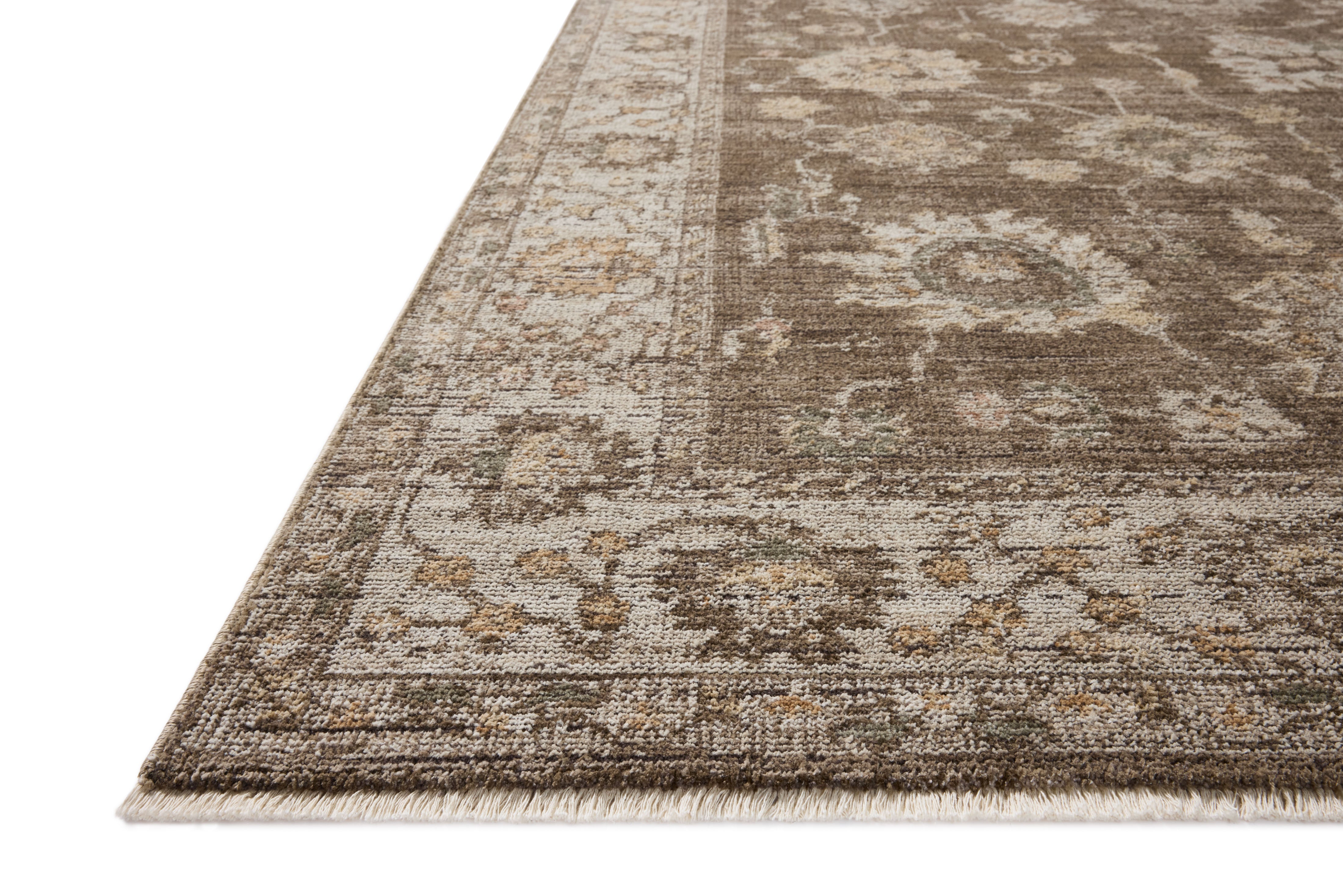 Layered in grounded bark and refined ivory hues with vintage patterns, the Priscilla PRL-01 Bark / Ivory Area Rug is a power-loomed 100% polyester area rug perfect for any setting
