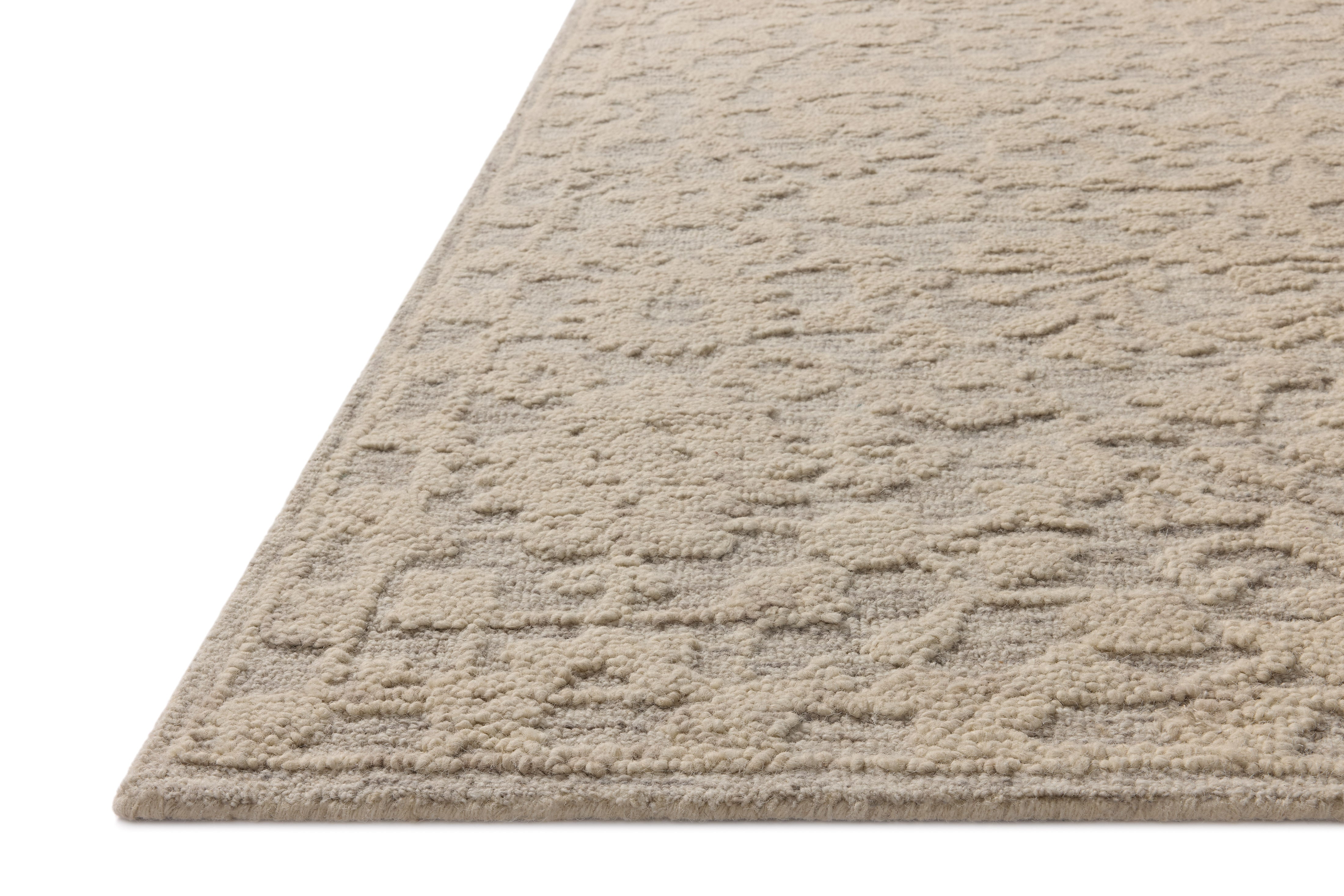 A hand-tufted wool and cotton area rug with floral flair in soft misty and refined ivory tones, the Prudence PRU-01 Mist / Ivory Area Rug anchors any room
