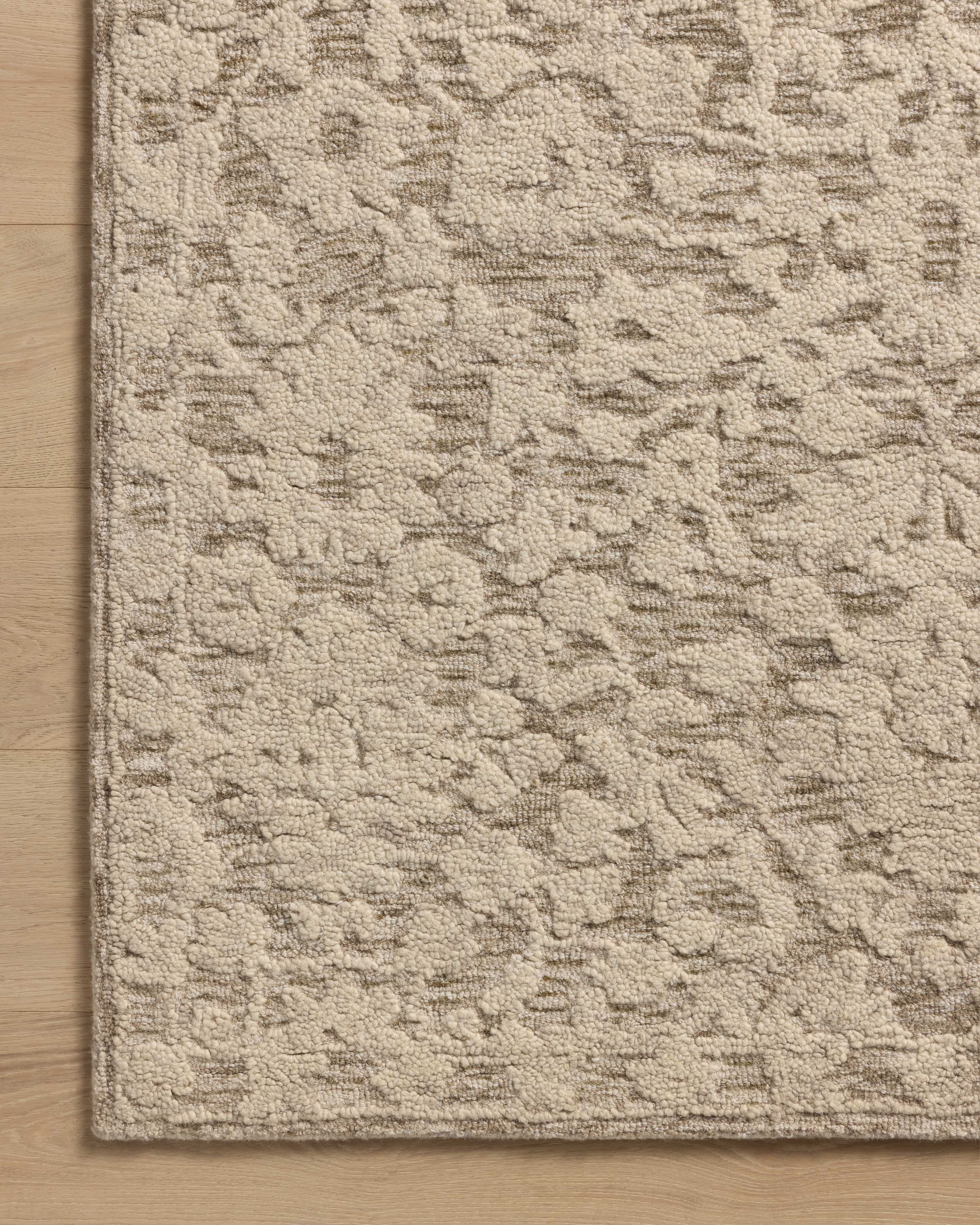 Crafted as a hand-tufted wool and cotton area rug, the Prudence PRU-01 Stone / Ivory Area Rug brings grounding stone and refined ivory warmth and floral character to your space
