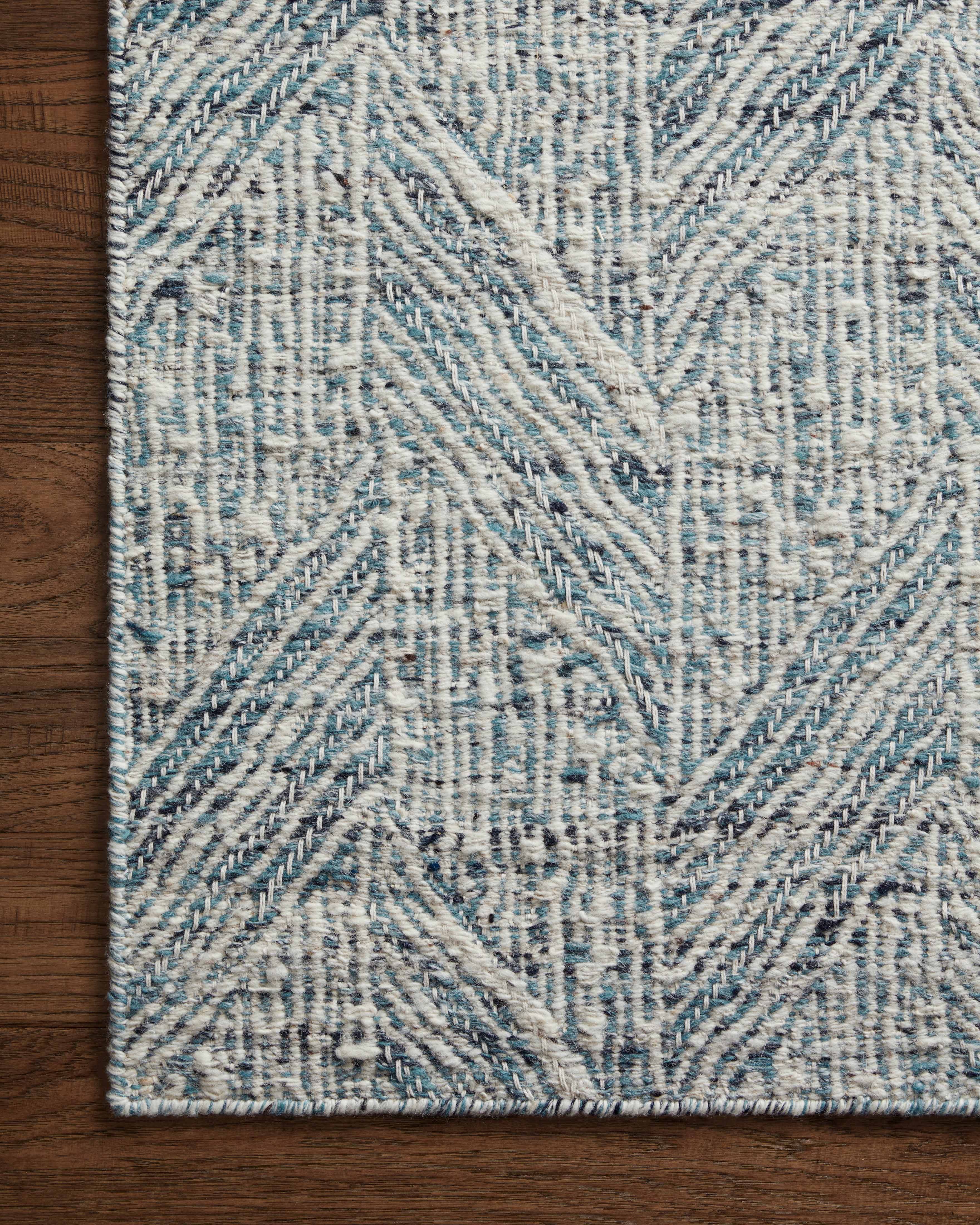 Raven RAV-01 Blue / Ivory Area Rug – Handwoven blue and ivory rug with layered geometric patterns, crafted from wool and cotton in India. GoodWeave certified for ethical production.