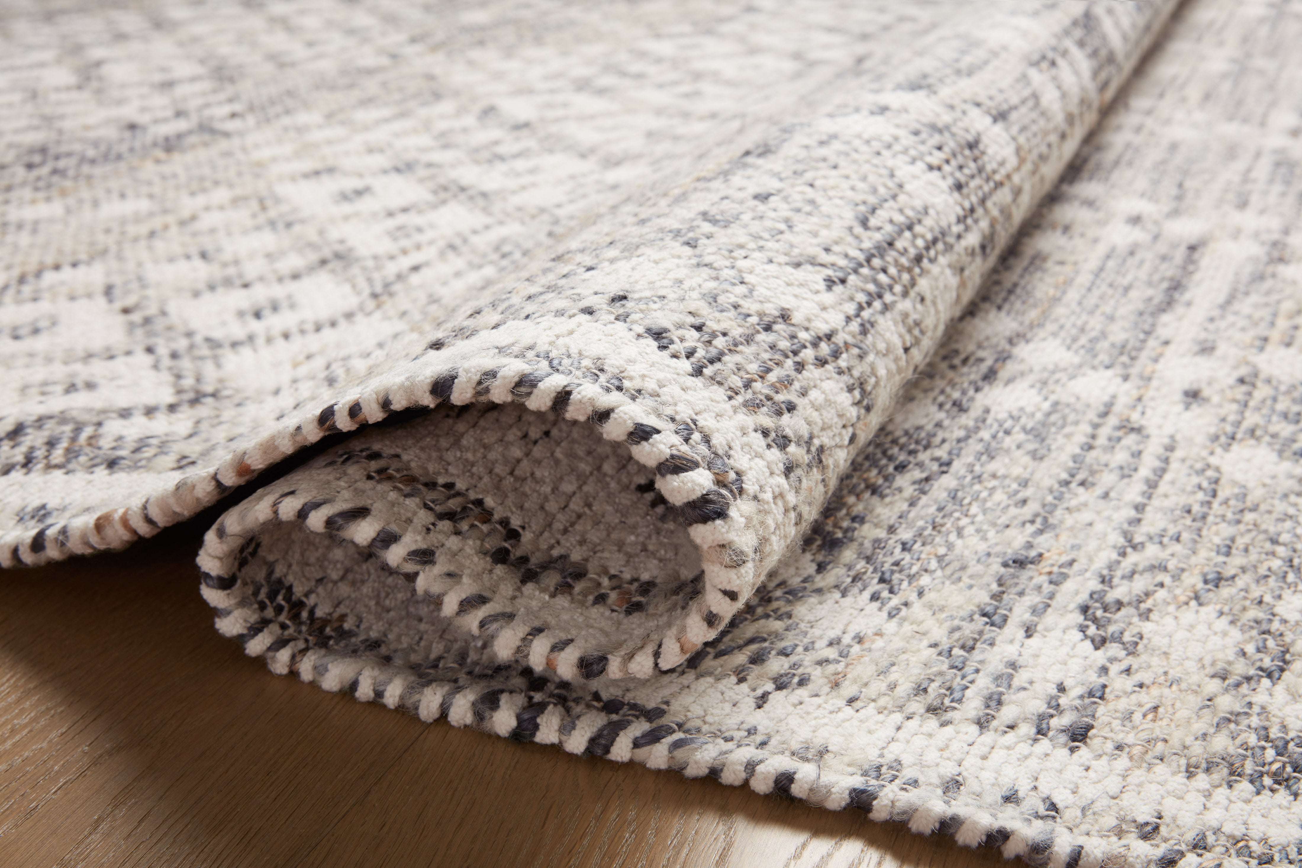 Rivers RIV-01 Area Rug featuring a reversible flatweave design with symmetrical motifs in denim and ivory tones, creating a watercolor effect for modern, neutral spaces.