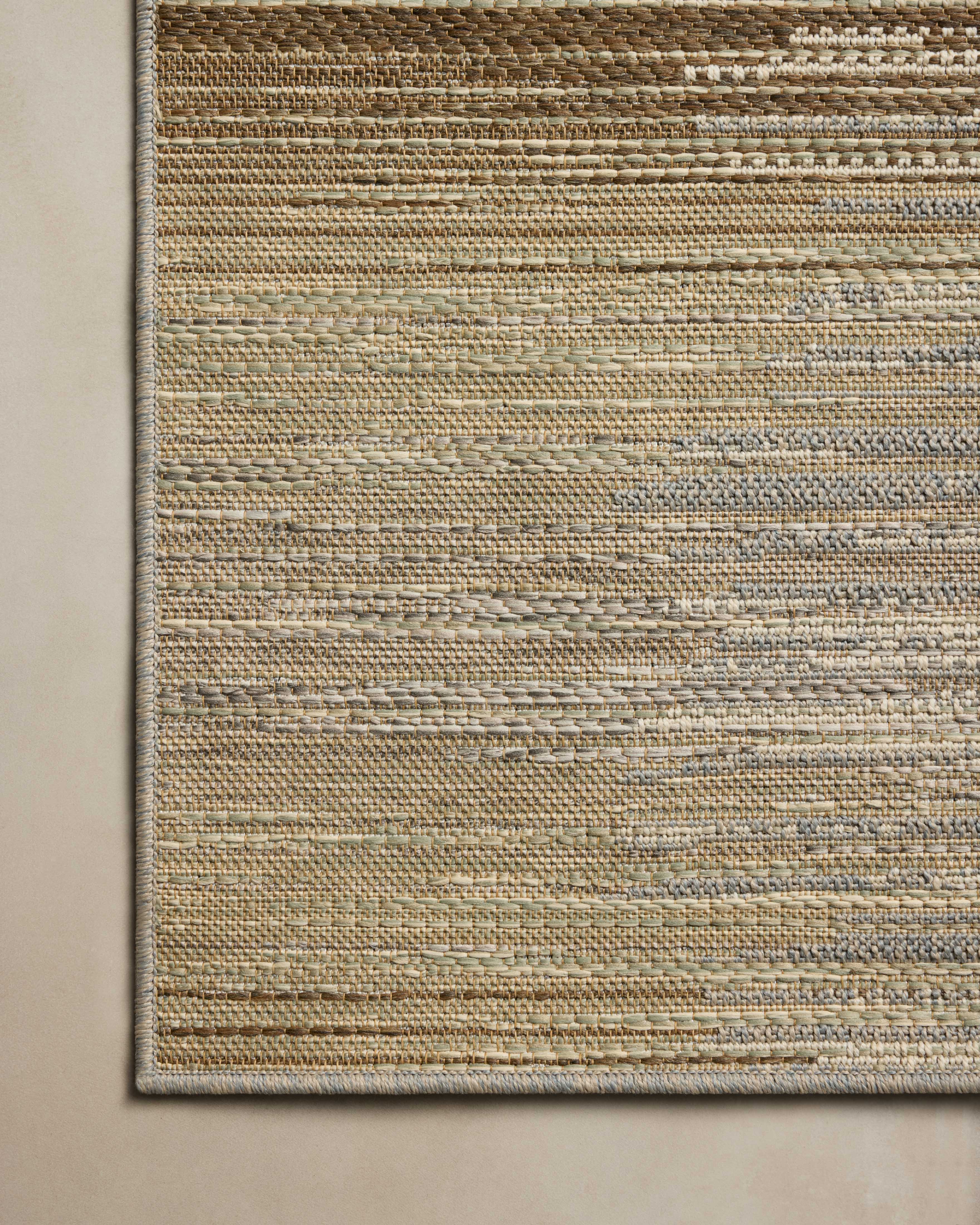 Designed in earthy and warm natural hues, the Saylor SAY-03 Earth / Natural Area Rug is a power-loomed polypropylene area rug that stands out