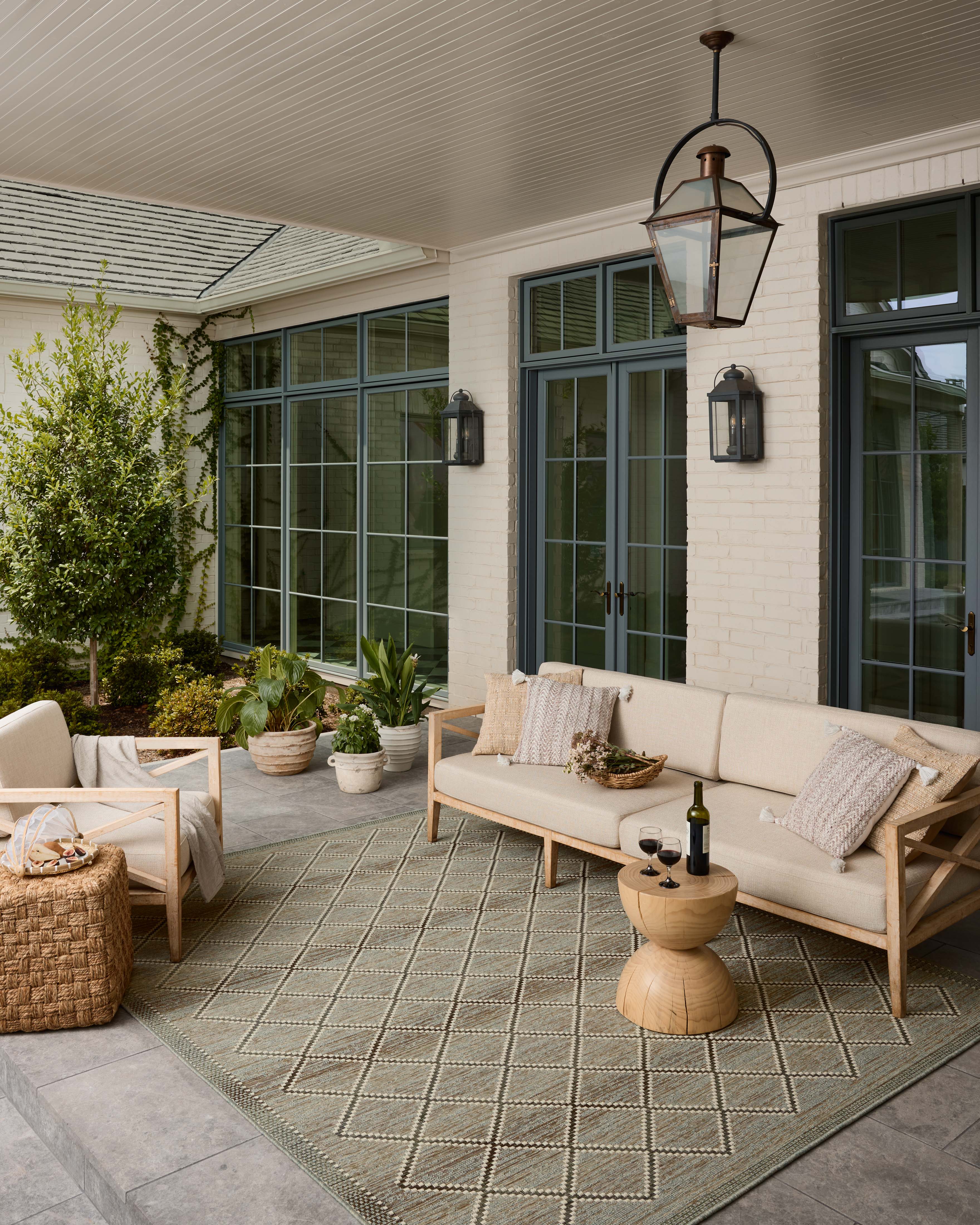 The Saylor SAY-04 Stone / Ivory Area Rug combines grounding stone and refined ivory tones with a power-loomed polypropylene area rug for effortless elegance