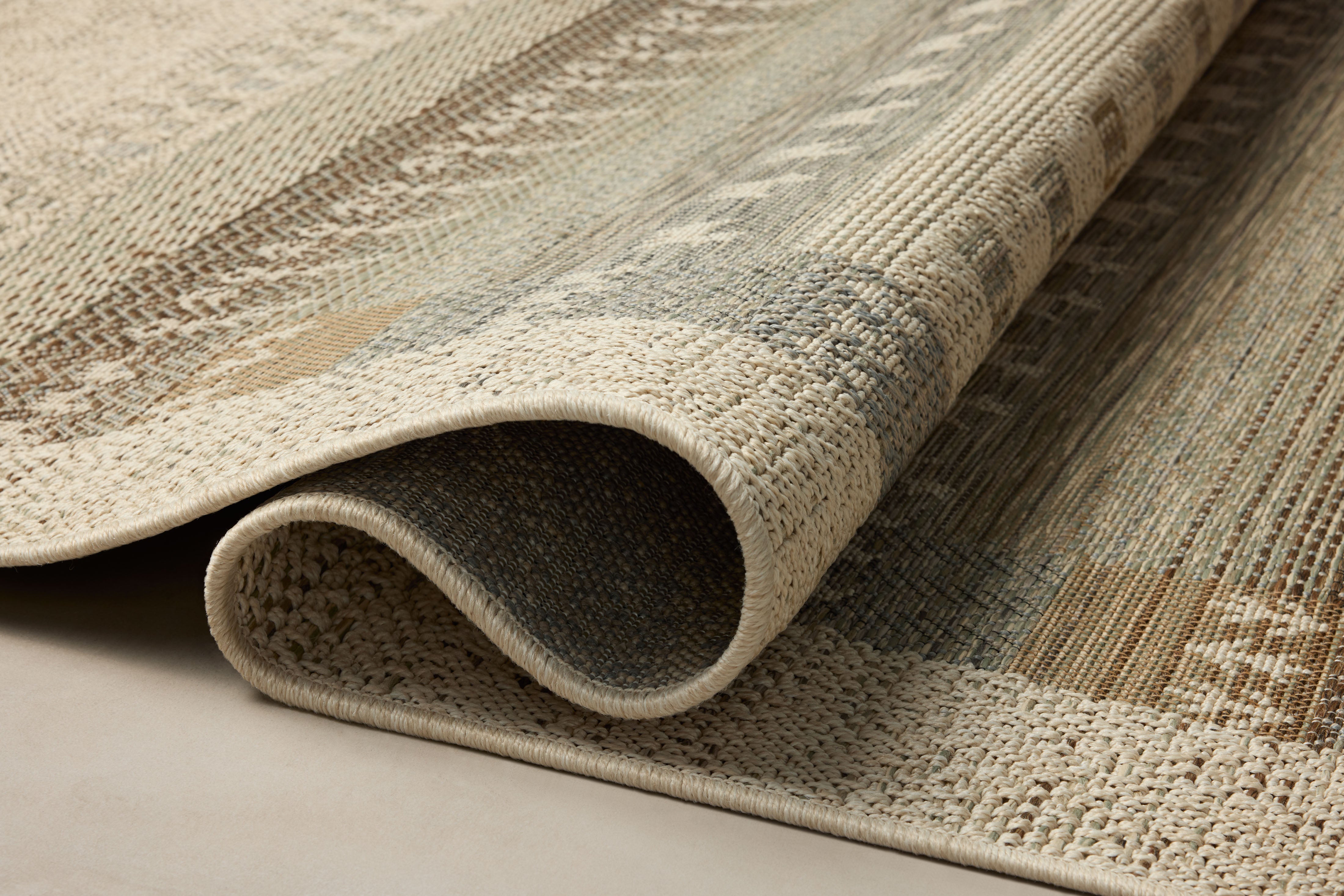 A power-loomed polypropylene area rug with refined ivory and earthy tones, the Saylor SAY-05 Ivory / Earth Area Rug adds character to any room