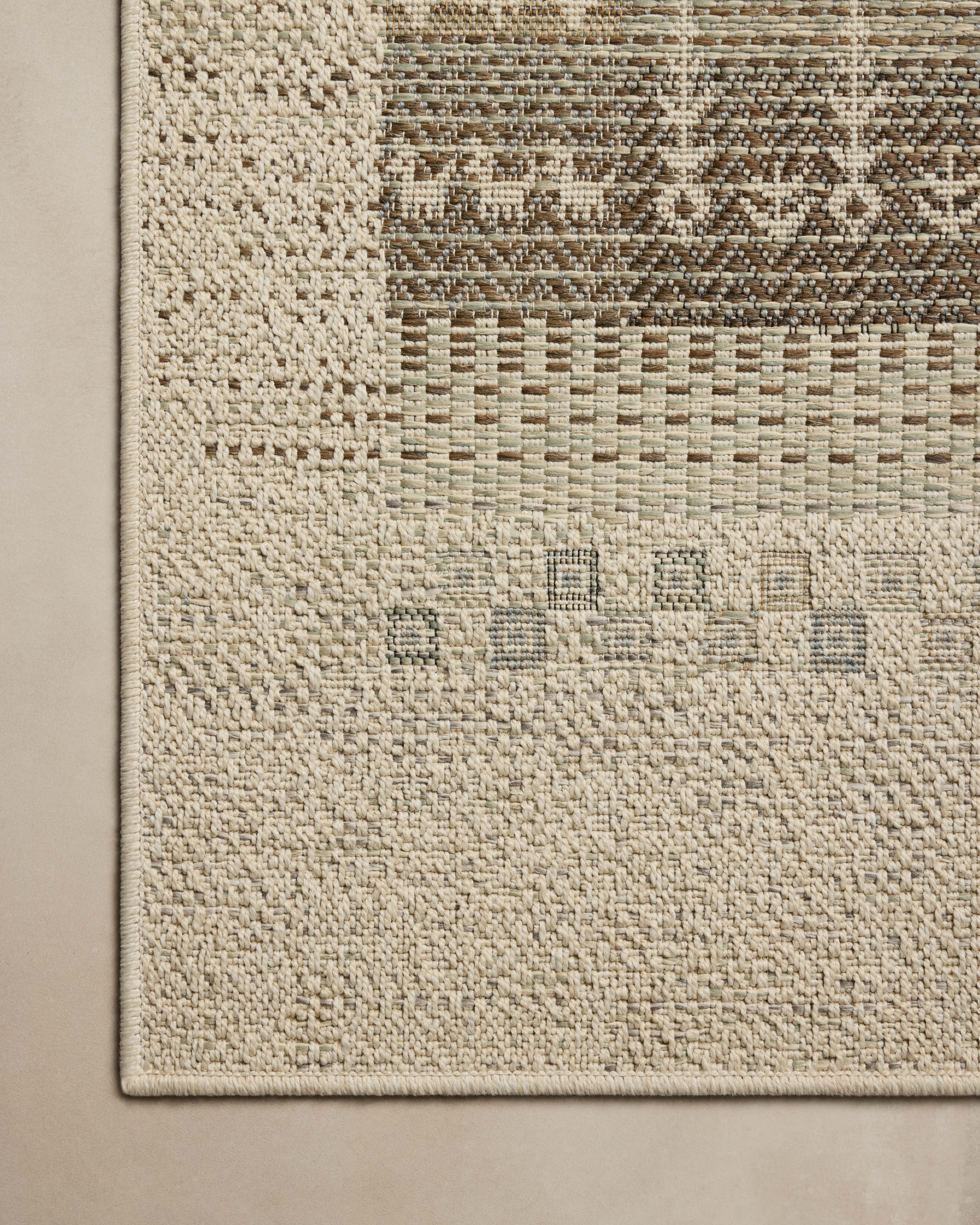 A power-loomed polypropylene area rug with refined ivory and earthy tones, the Saylor SAY-05 Ivory / Earth Area Rug adds character to any room